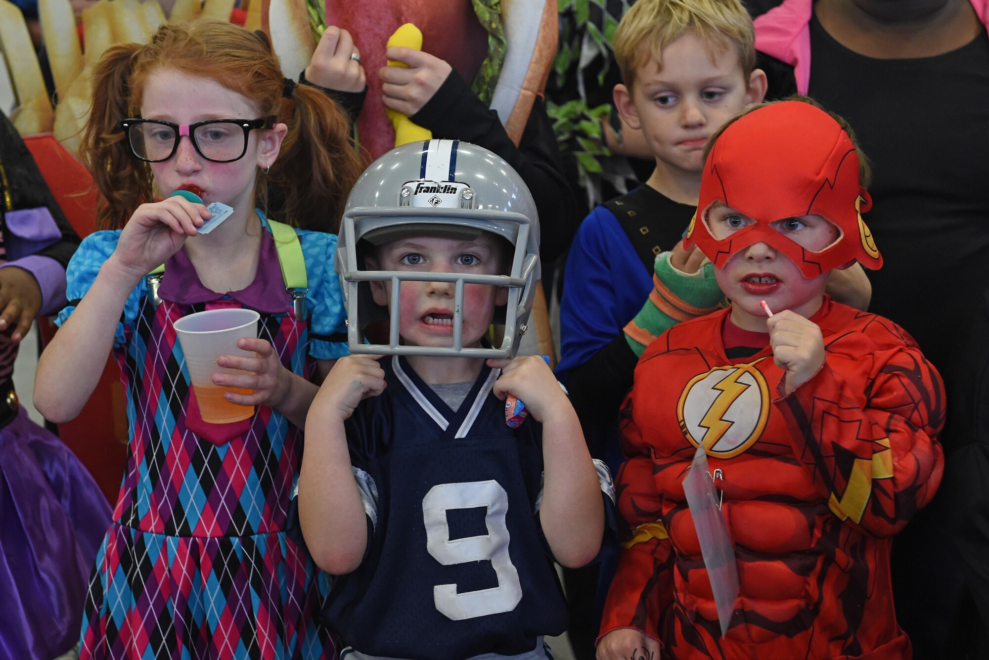 Service members and families participate in a costume fun run in Hangar 5 at Joint Base Elmendorf-Richardson, Alaska, Oct. 28, 2016. The run was a mile long and prizes were awarded to the top three finishers as well as best adult and child costumes. 