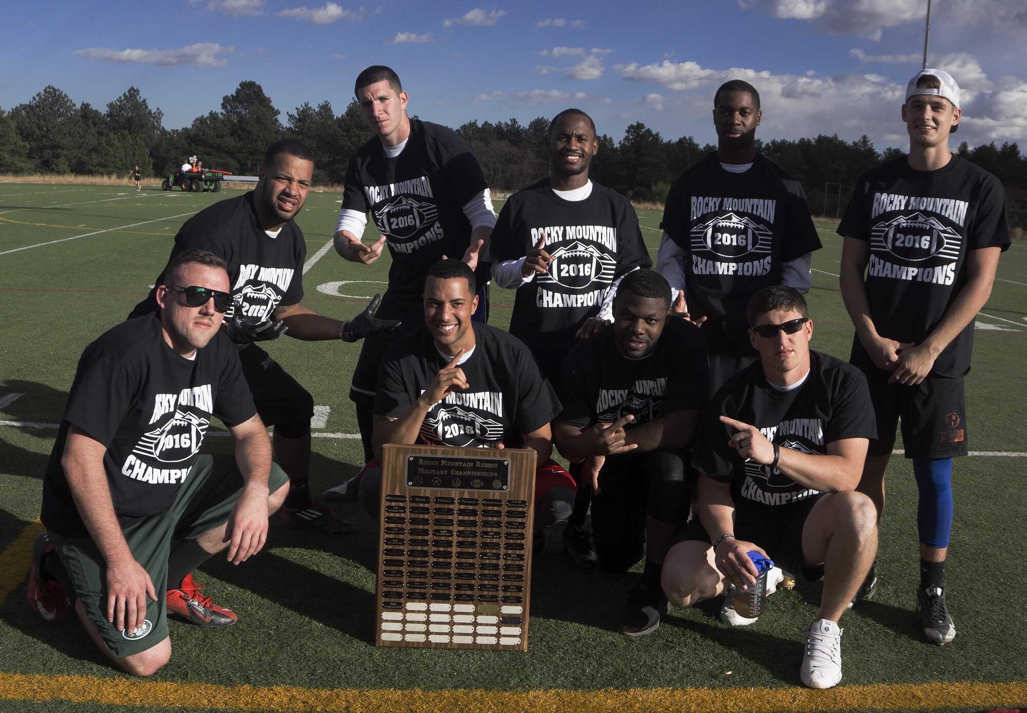The F.E. Warren Air Force Base, Wyo., intramural flag football team poses after winning the Rocky Mountain Intramural Flag Football Tournament at the U.S. Air Force Academy, Colorado Springs, Colo., Oct. 29, 2016. The team was presented with a plaque, which they will hold until the next Rocky Mountain Basketball tournament next year. Warren won the tournament with a record of two wins and one loss. (U.S. Air Force photo by Senior Airman Brandon Valle)