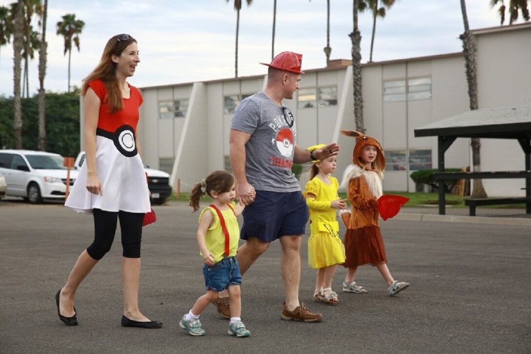 Marines and their families participate in “Trunk or Treat” at Marine Corps Base Camp Pendleton, Calif., Oct. 28, 2016. The event was hosted by I Marine Expeditionary Force Headquarters Group, and included trick or treating, games, a costume contest, and a free movie showing. (U.S. Marine Corps photo by Pfc. Robert Bliss)