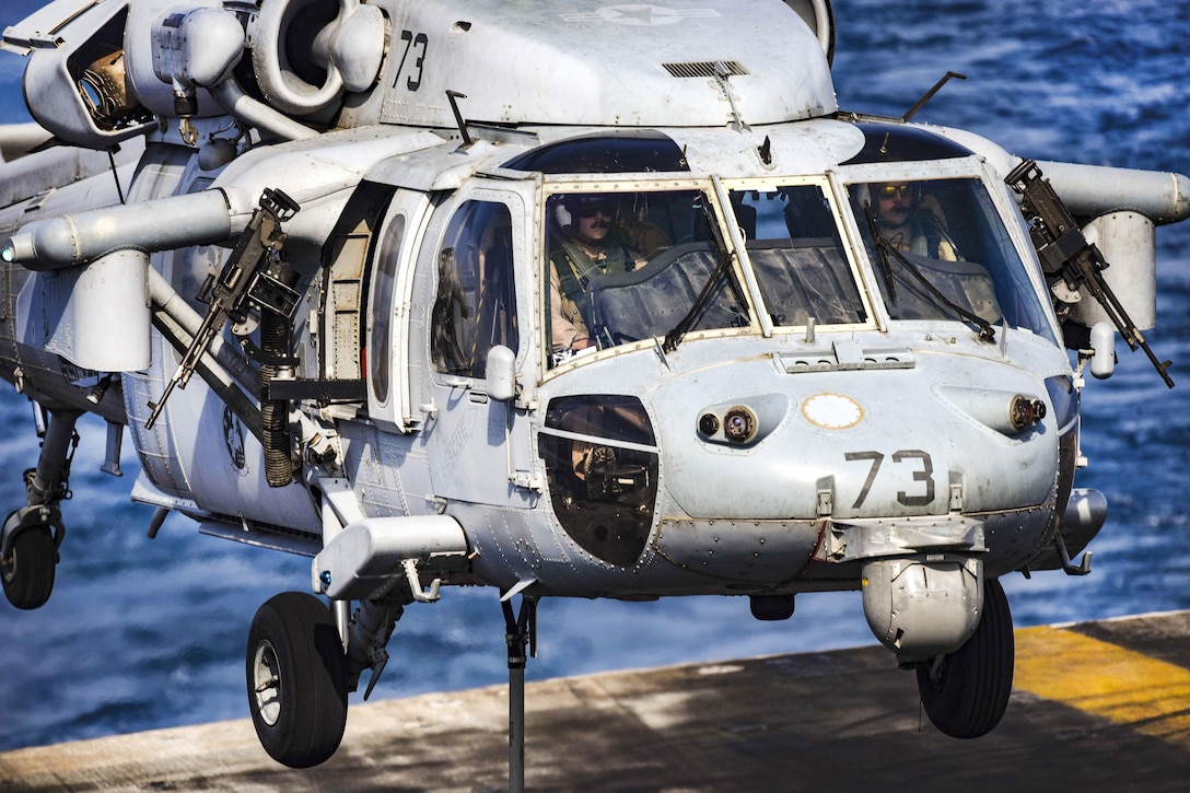 An MH-60S Seahawk helicopter assigned to Helicopter Sea Combat Squadron 26 unloads supplies on the flight deck of the aircraft carrier USS Dwight D. Eisenhower during vertical replenishment operations in the Persian Gulf, Oct. 28, 2016. Navy photo by Seaman Christopher A. Michaels