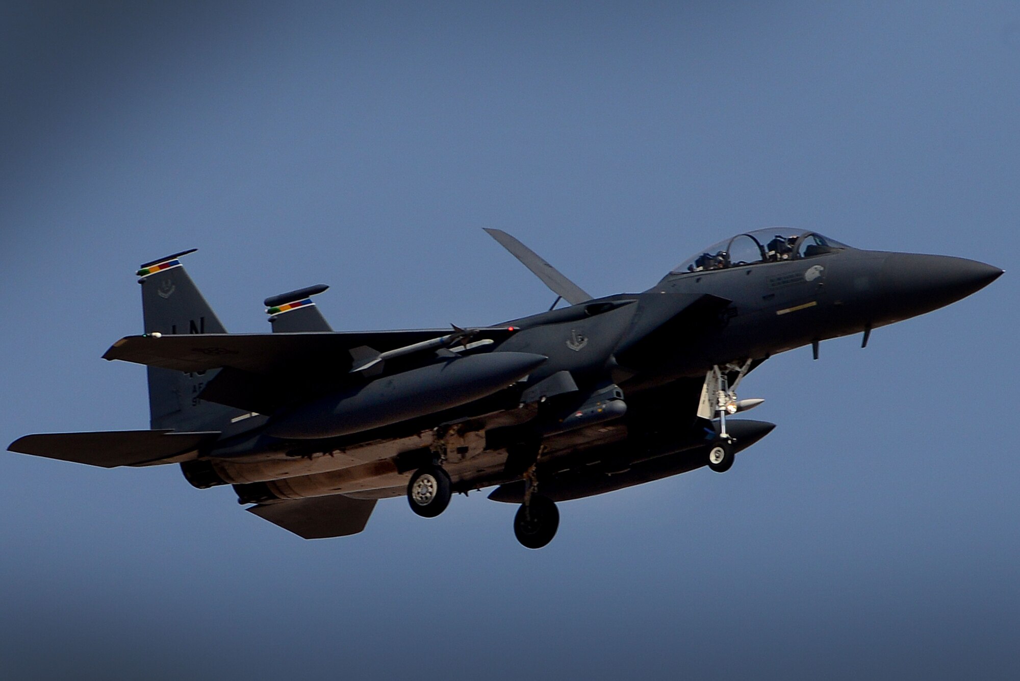 An F-15E Strike Eagle from the 492nd Fighter Squadron returns from a sortie in support of exercise Red Flag 16-4 at Nellis Air Force Base. Nevada Aug 24. The 492nd FS recently took advantage of a rare opportunity to promote two of their own during a sortie over the California desert in support of exercise Green Flag 16-9 Sep 1. (U.S. Air Force photo/ Tech. Sgt. Matthew Plew)