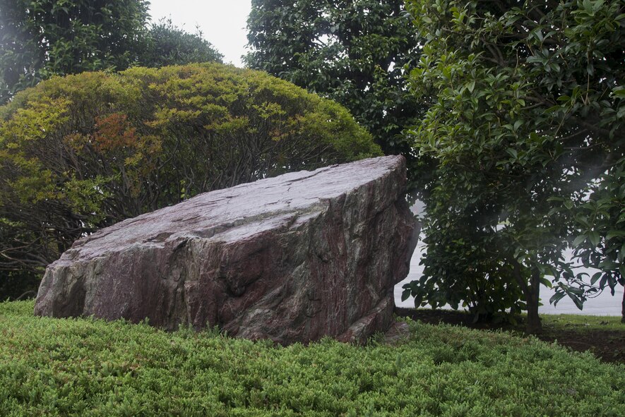 The Kofu rock is displayed in the distinguished visitor garden at Yokota Air Base, Japan, Aug. 30, 2016. This rock was presented to Tama Army Airfield by Emperor Hirohito (Showa) after an inspection held Apr. 10, 1944. Kofu rocks are a kind of volcanic rock often seen in the Yamanashi Prefecture and during the Samurai period was regarded as a symbol of Japanese solidarity. (U.S. Air Force photo by Senior Airman David C. Danford/Released)