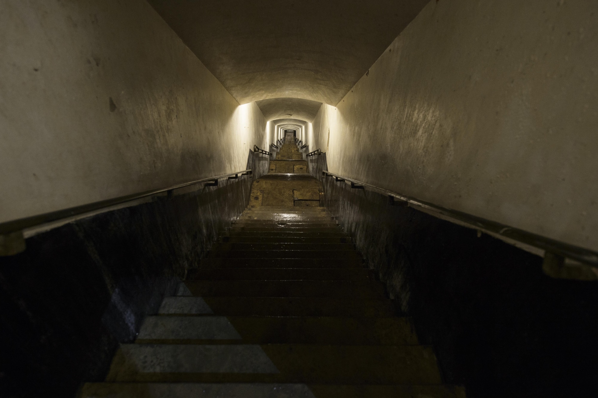 More than 25 Airmen from Spangdahlem Air Base, Germany, worked to help preserve and excavate a World War II era bunker at Fort Aubin-Neufchateau, Belgium, Aug. 28, 2016. The stairs to a bunker descend several hundred feet into the fort. (U.S. Air Force photo by Staff Sgt. Jonathan Snyder/Released)