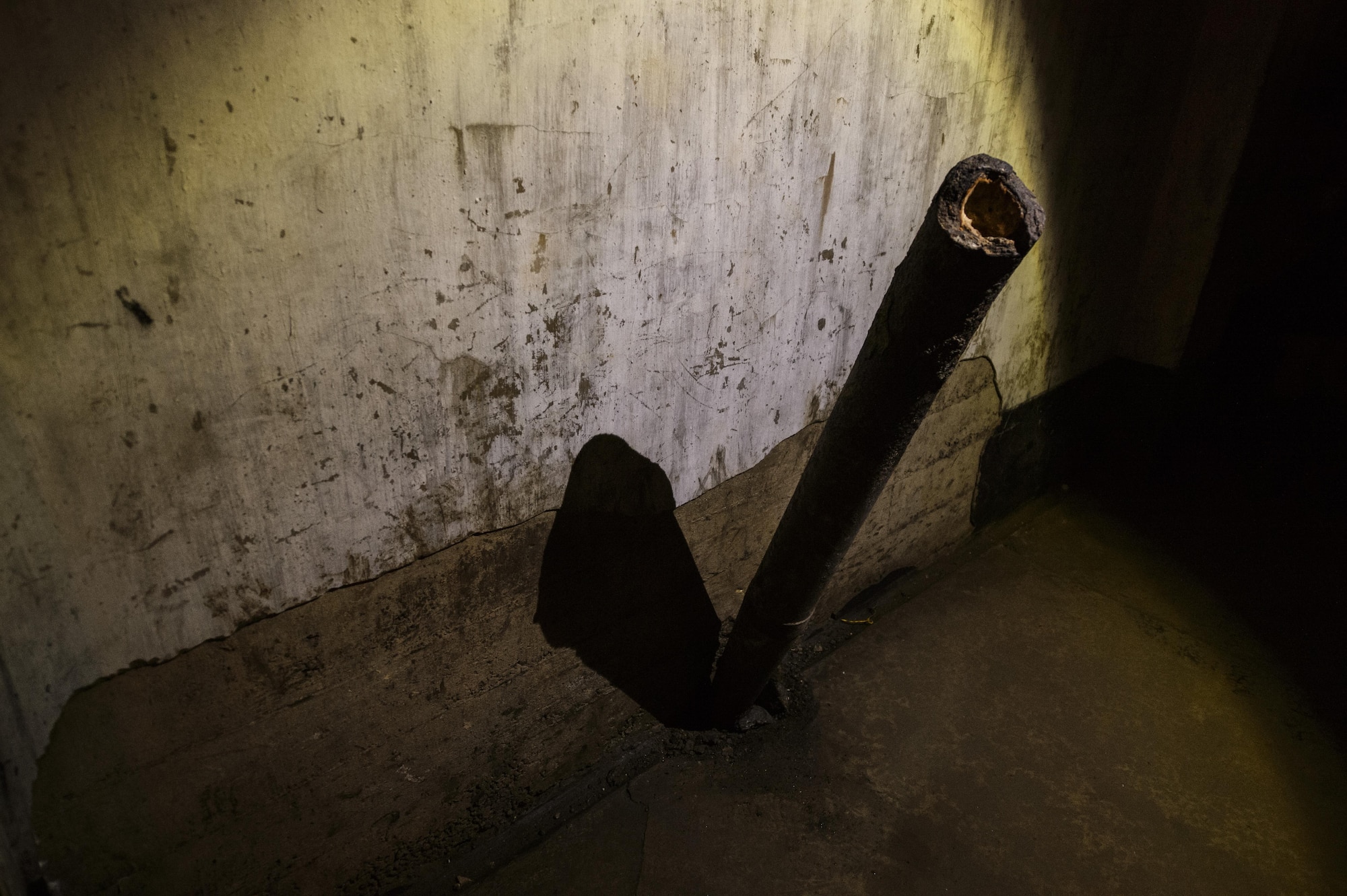 A Roschling shell sticks out of a bunker floor at Fort Aubin-Neufchateau, Belgium, Aug. 28, 2016. Enemy forces used the captured bunker to test their top secret bunker-busting Roschling shell. (U.S. Air Force photo by Staff Sgt. Jonathan Snyder/Released)