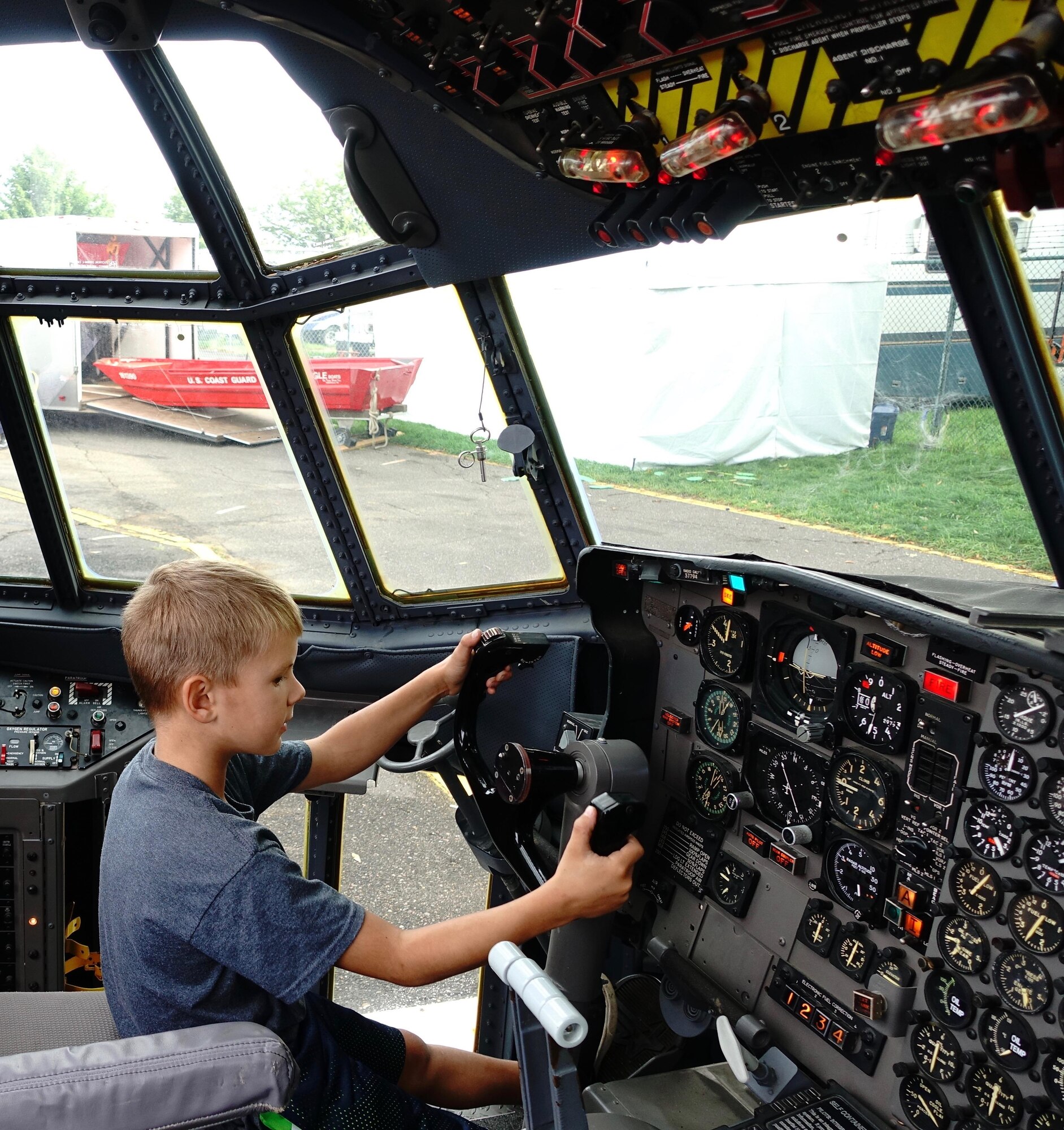 A future aviator imagines what it might be like to pilot a C-130 aircraft at the 934th Airlift Wing display at the Minnesota State Fair Aug. 30.