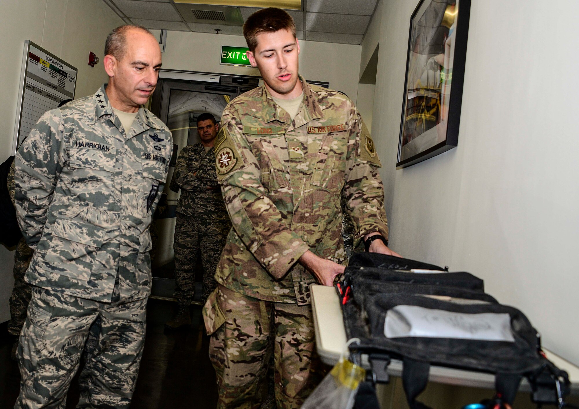 Senior Airman Aaron Long, 379th Expeditionary Medical Group surgical technician, shows Lt. Gen. Jeffrey L. Harrigian, U.S. Air Forces Central Command commander, surgical mobility bags to be palletized and placed on aircraft for delivery within the U.S. Air Forces Central Command area of responsibility during Harrigian’s visit with the 379th Air Expeditionary Wing Aug. 11, 2016, at Al Udeid Air Base, Qatar. Harrigian and Chief Master Sgt. Joseph Montgomery, USAFCENT command chief, toured various facilities and met 379th AEW Airmen to get an inside look at what they do on a daily basis. (U.S. Air Force photo/Senior Airman Janelle Patiño/Released)