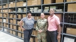 DLA Distribution Mapping at Fort Bragg employees, left to right, Marnetia Page, Army Staff Sgt. Monica Sotobenavides and Benedict Beason in Distribution’s warehouse, which provides 10,000 square ft. of acclimatized, racked bay storage for mapping products.   