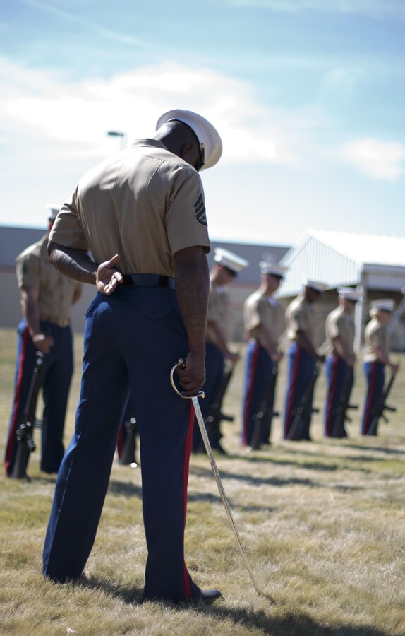 Marines from Brooklyn’s 6th Communication Battalion bow their heads during a remembrance ceremony for two Reserve Marines from the unit at Floyd Bennett Field, Aug. 30, 2016. Sgt. Maj. Michael S. Curtin and Gunnery Sgt. Matthew D. Garvey, first responders with the city’s police fire departments, lost their lives at the World Trade Center on 9/11. To honor their memory, Marine Corps Reserve Center Brooklyn dedicated the Curtin Garvey Complex and a 9/11 monument made partially with steel from the World Trade Center. The remembrance ceremony is being held in conjunction with the U.S. Marine Corps Reserve Centennial, celebrating 100 years of service and selfless dedication to the nation.