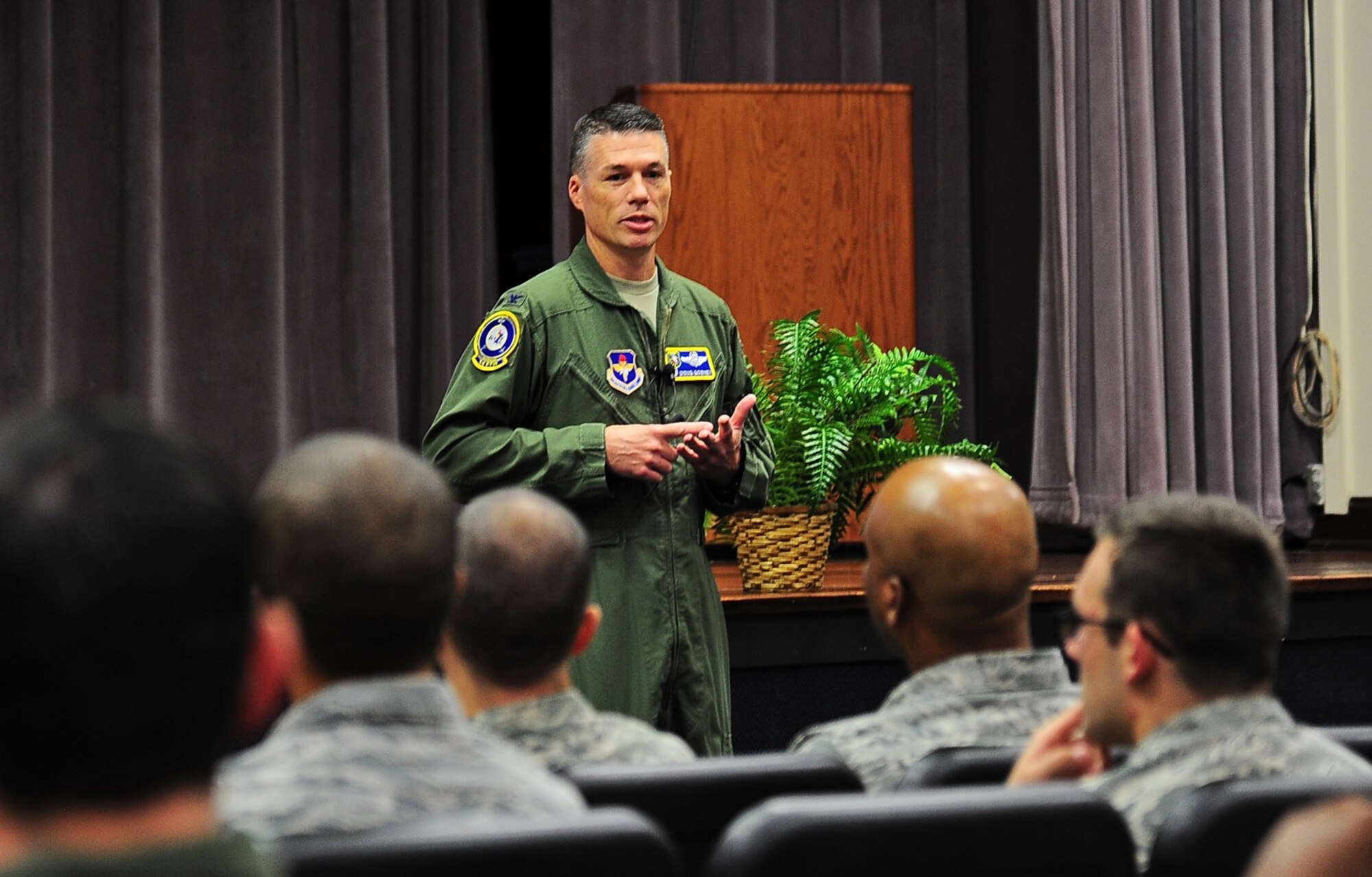 Col. Douglas Gosney, 14th Flying Training Wing Commander, speaks to Team BLAZE personnel during an all call Aug. 25 at Columbus Air Force Base, Mississippi. Gosney used to opportunity to introduce himself and his family. He then explained what he values most in people such as Integrity, Teamwork, Respect, Discipline, attention to detail, and loyalty. (U.S. Air Force photo/Staff Sgt. Stephanie Englar)