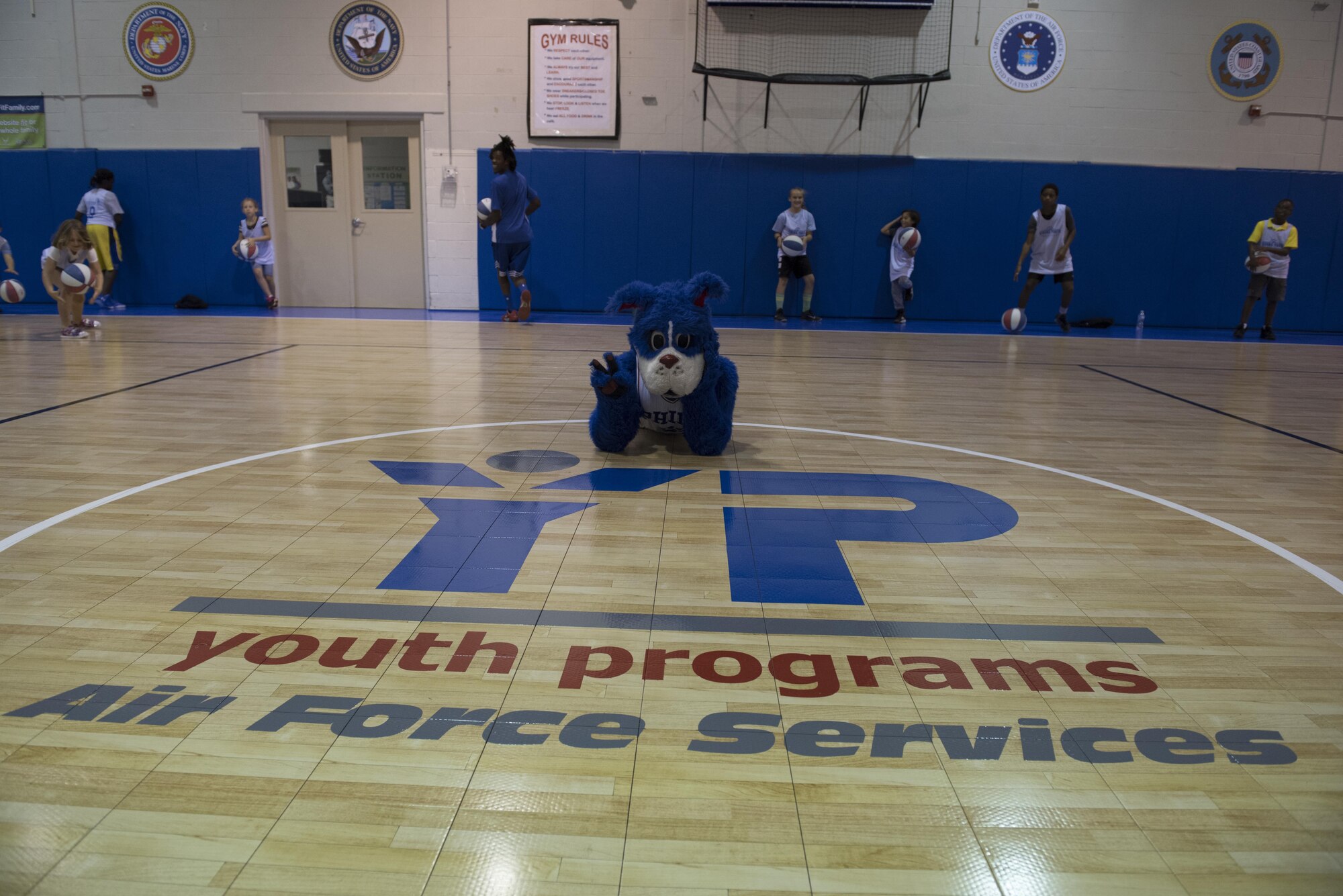 The 76ers’ mascot, Franklin the dog, paid a visit to the new Falcon Courts Youth Center Gym on Joint Base McGuire-Dix-Lakehurst, N.J., Aug. 31, 2016. Franklin and the 76ers’ trick shot team, Phlight Squad, entertained and coached children from military families at a youth basketball clinic. 