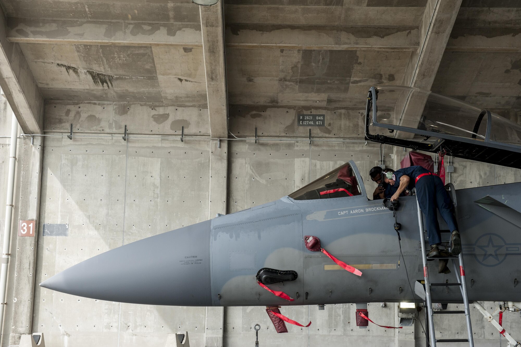 Maintainers from the 18th Aircraft Maintenance Squadron and pilots assigned to the 44th and 67th Fighter Squadrons conduct a mass aircraft generation exercise Aug. 22-23, 2016, at Kadena Air Base, Japan. Maintainers loaded weapons onto F-15 Eagles before the aircraft taxied and were dispersed around the flightline. . (U.S. Air Force photo/Senior Airman Peter Reft)