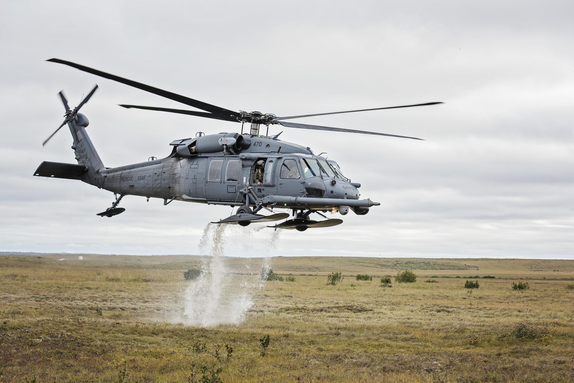 An HH-60 Pave Hawk helicopter from the 210th Rescue Squadron takes off after loading simulated casualties during exercise Arctic Chinook near Kotzebue, Alaska, Aug. 24, 2016. Arctic Chinook is a joint U.S. Coast Guard and U.S. Northern Command sponsored exercise, which focuses on multinational search and rescue readiness to respond to a mass rescue operation requirement in the Arctic. (U.S. Air National Guard photo/Staff Sgt. Edward Eagerton)