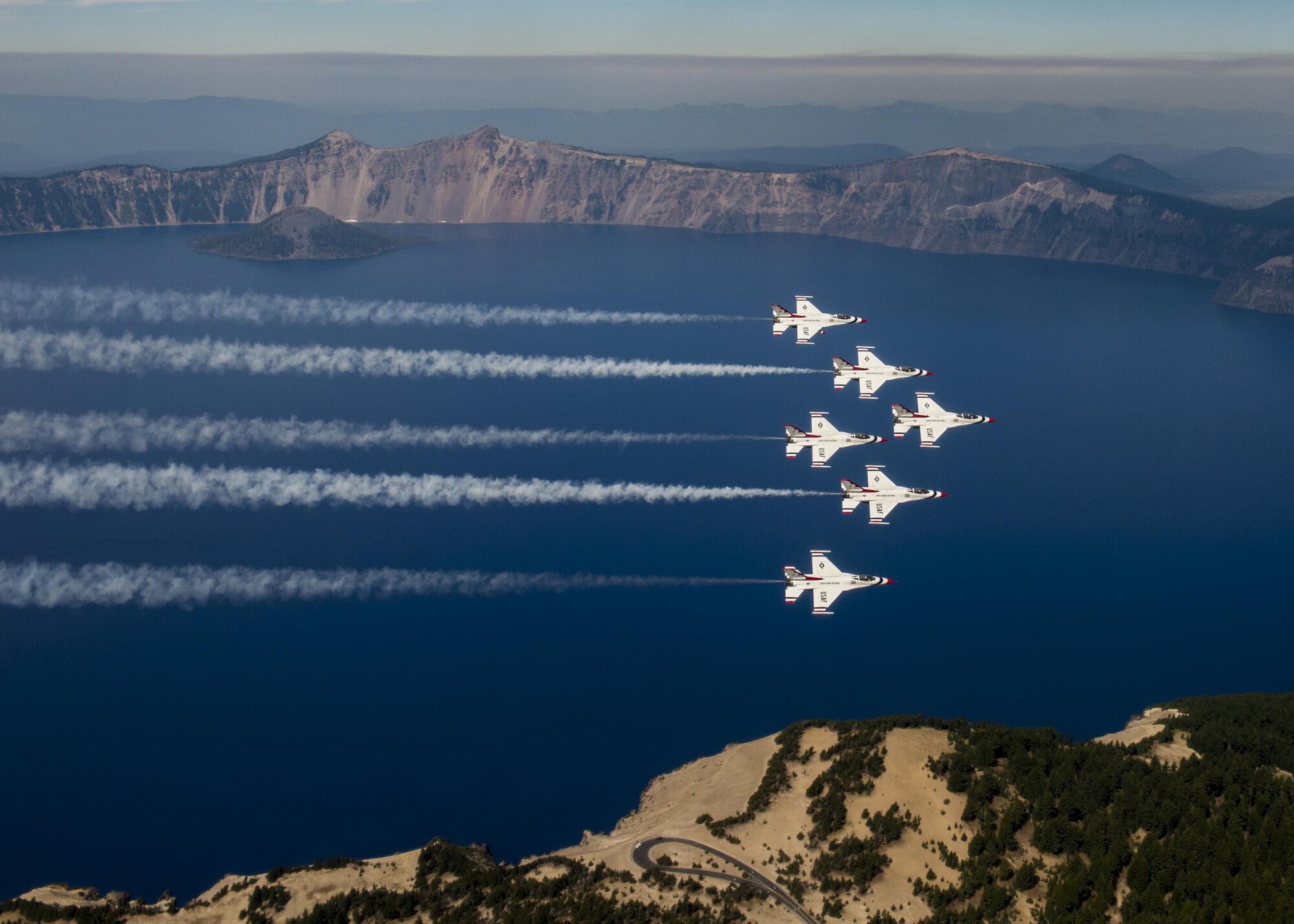The Thunderbirds fly over Crater Lake, Oregon, during their return to Nellis Air Force Base, Nev., Aug. 29, 2016. The Thunderbirds performed at the Airshow and Warrior Expo at Joint Base Lewis-McChord, Wash., Aug. 27-28. (U.S. Air Force photo/Tech. Sgt. Christopher Boitz)