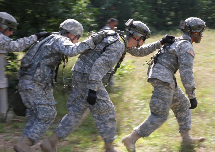 FORT MCCOY, Wis. - U.S. Army Reserve Soldiers with the 75th Combat Support Hospital run out to retrieve a mock casualty during a medical evacuation Aug. 18 during Combat Support Training Exercise 86-16-03 at Fort McCoy, Wis. (U.S. Army Reserve photo by Staff Sgt. Debralee Best)