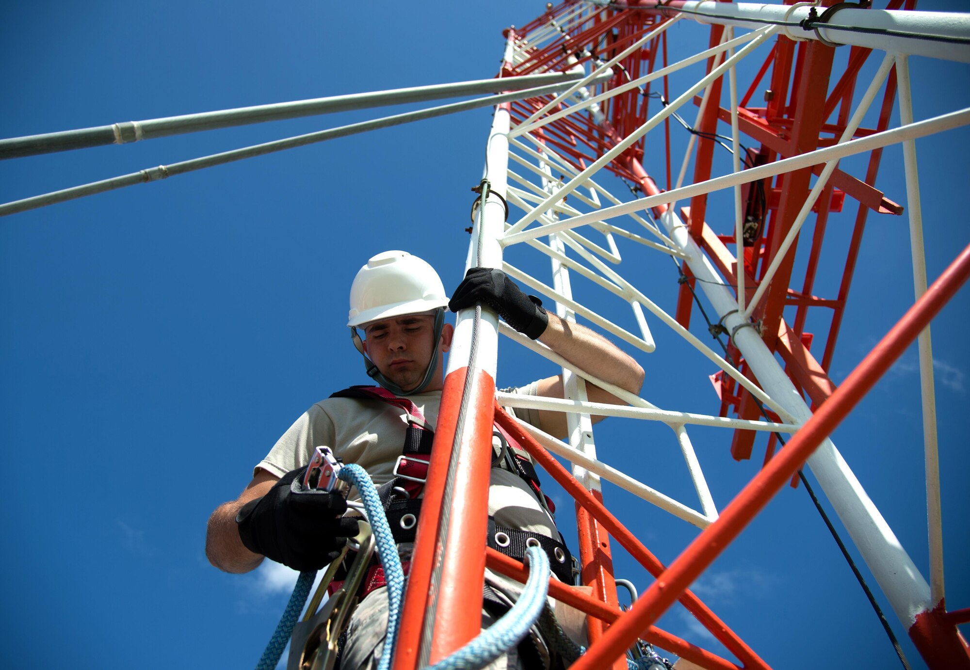 Airman 1st Class Sean Fitzpatrick, an airfield systems technician with the 6th Operations Support Group, climbs the glideslope tower to perform routine maintenance Aug. 29, 2016 at MacDill Air Force Base, Fla. The glideslope tower communicates with a localizer to support MacDill’s instrument landing systems. (U.S. Air Force photo by Airman 1st Class Rito Smith) 