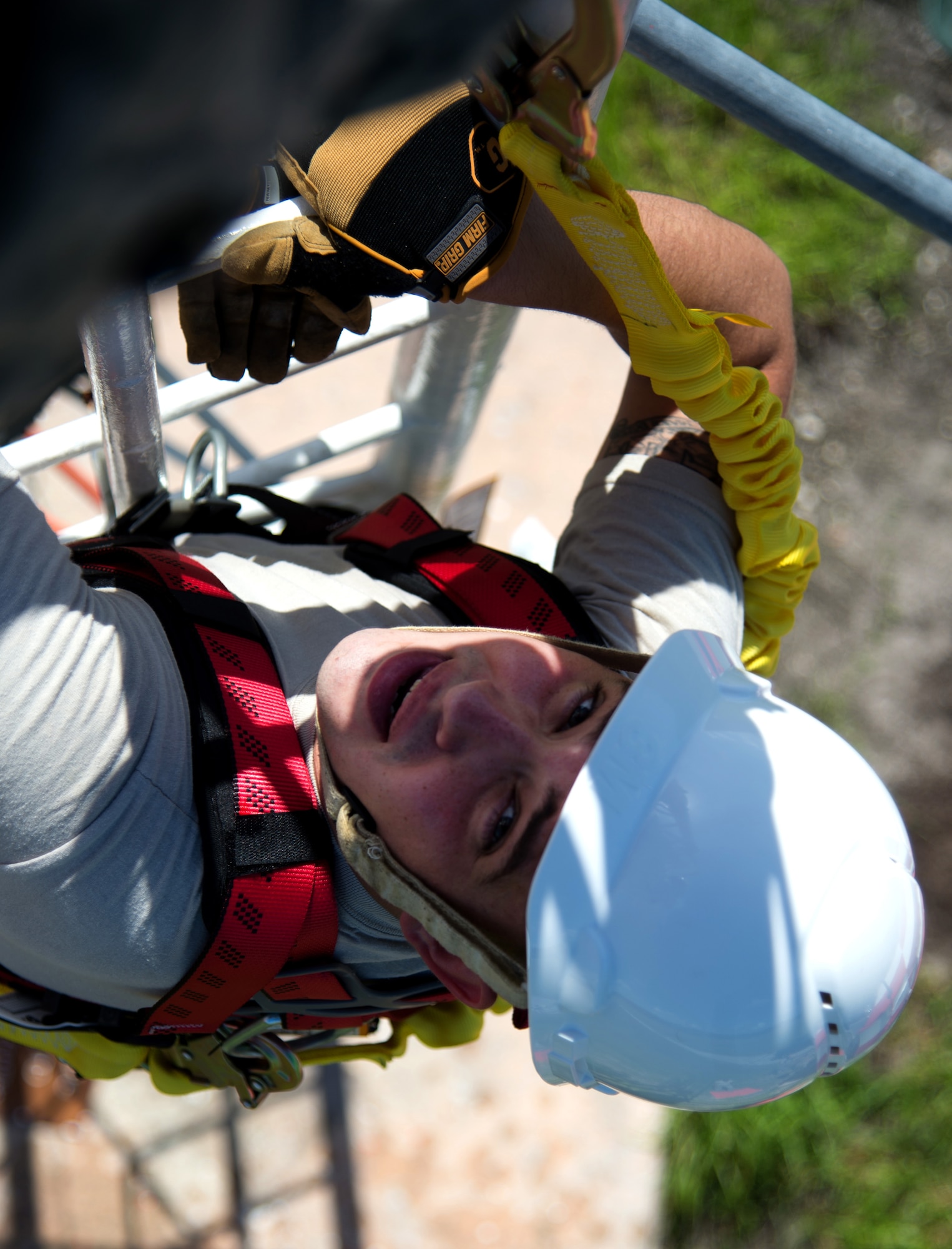Staff Sgt. George Adney, the NCO in charge of training and education with the 6th Operations Support Squadron, climbs the glideslope tower to perform routine maintenance Aug. 29, 2016 at MacDill Air Force Base, Fla. Adney is in charge of instructing new Airmen on proper safety and protocol before climbing the tower. (U.S. Air Force photo by Airman 1st Class Rito Smith)