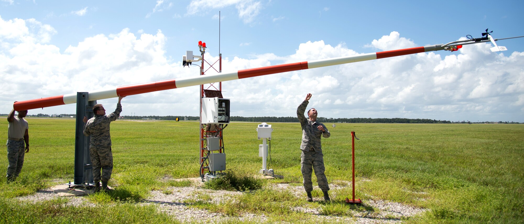 Airfield systems Airmen from the 6th Operations Support Squadron lower the weather tower for maintenance Aug. 29, 2016 at MacDill Air Force Base, Fla. The weather tower has a fake spinning bird on top that relays weather conditions to the air traffic control tower. (U.S. Air Force photo by Airman 1st Class Rito Smith)