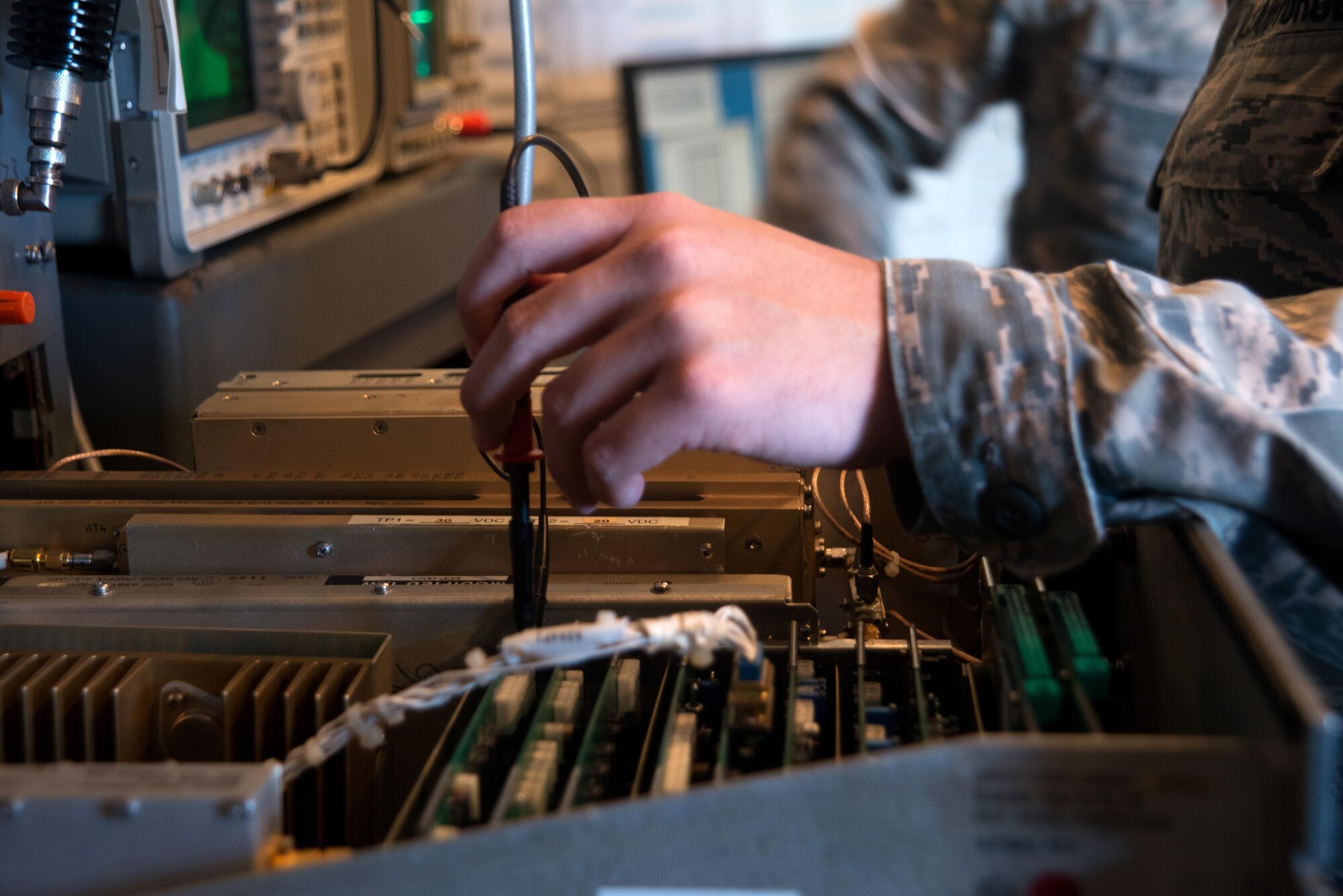 Staff Sgt. Scott Phillips, the NCO in charge of maintenance and data collection with the 6th Operations Support Squadron, tests the tactical air navigation system (TACAN) Aug. 29, 2016 at MacDill Air Force Base, Fla. Airfield systems Airmen conduct routine tests to ensure equipment is functioning properly. (U.S. Air Force photo by Airman 1st Class Rito Smith) )