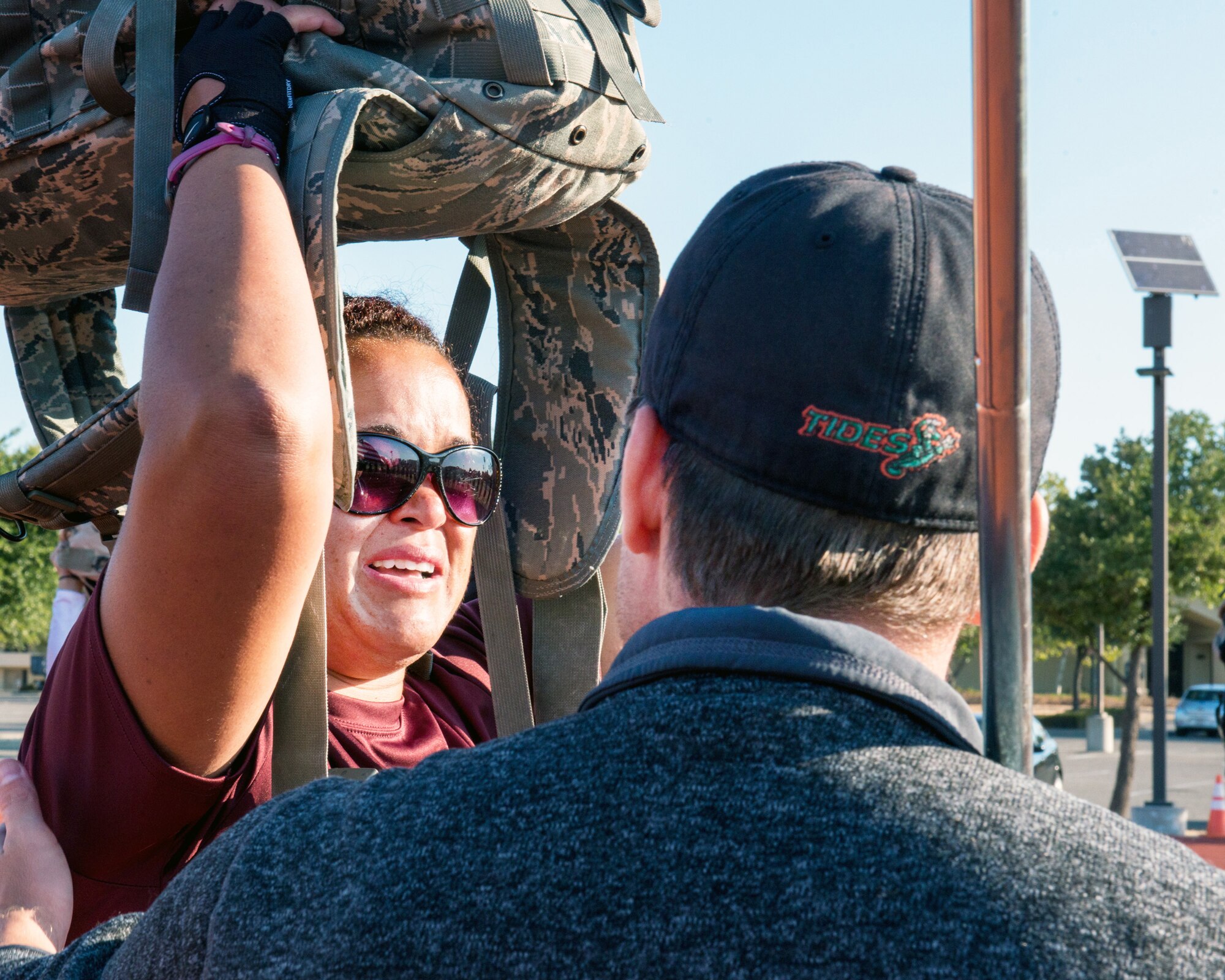 GORUCK cadre “Mikey” motivates Jenny Gupton as she struggles to hold the rucksack over her head during the GORUCK Light training at Travis Air Force Base, Calif., Aug. 26. GORUCK Light is a snapshot of the type of training that Special Operations Forces participate in and all proceeds benefit the Green Beret Foundation. (U.S. Air Force photo by Louis Briscese)