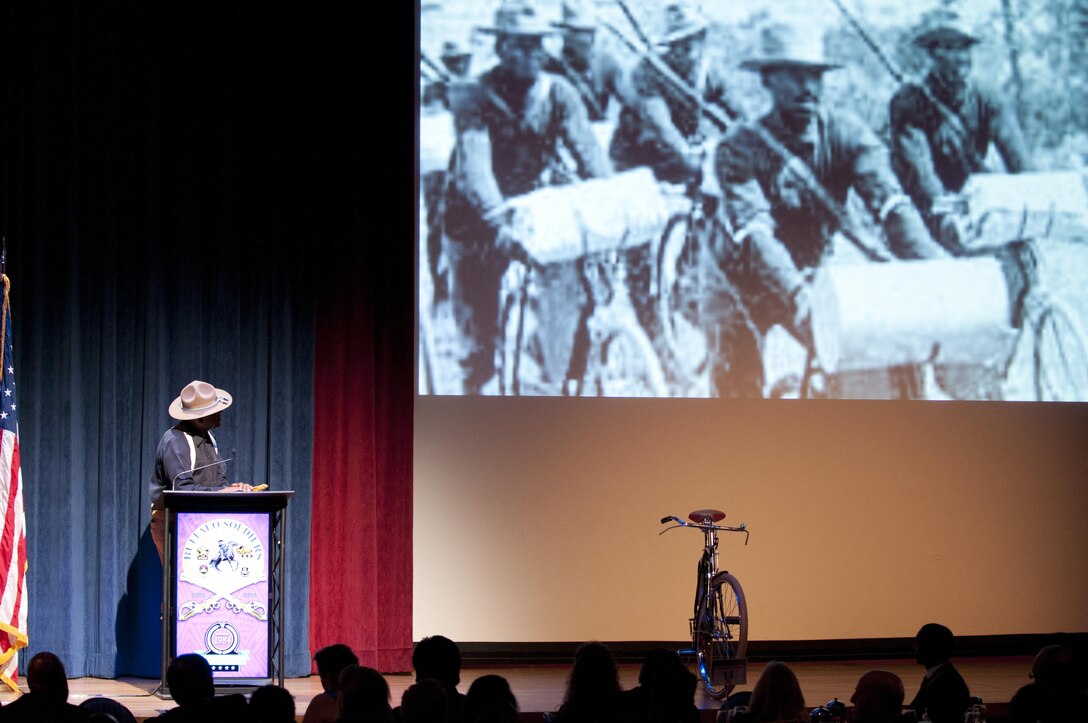 Ron Jones, a member of the 9th and 10th Cavalry (Horse) Association, presents a historical vignette on the “Iron Riders”—the 25th Infantry U.S. Army Bicycle Corps, at the Black Chamber of Orange County’s Annual Banquet at the Disneyland Hotel August 27, 2016, in Anaheim, Calif. The banquet, held annually, highlights a black history theme each year. This year’s theme was the legacy of Buffalo Soldiers, or Soldiers who served in segregated African-American units from 1866-1954. (U.S. Army photo by Sgt. 1st Class Alexandra Hays, 79th Sustainment Support Command).