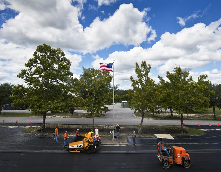 Asphalt paving is underway in front of the 919th Special Operations Wing’s Haugen Headquarters building Aug. 31 at Duke Field, Fla.  (U.S. Air Force photo/Tech. Sgt. Sam King)