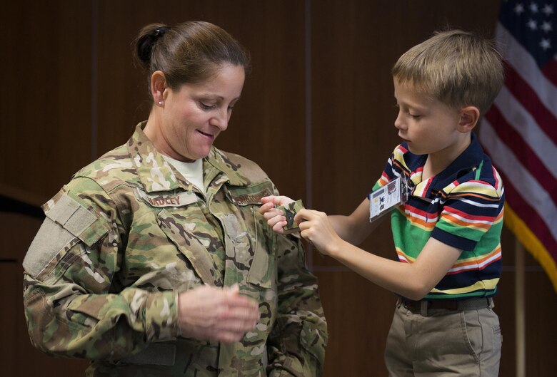 Leslie Hadley waits for her son to place on her new colonel rank during a the 711th Special Operations Squadron commander’s pin-on ceremony Sept. 1 at Duke Field, Fla.  (U.S. Air Force photo/Tech. Sgt. Sam King)