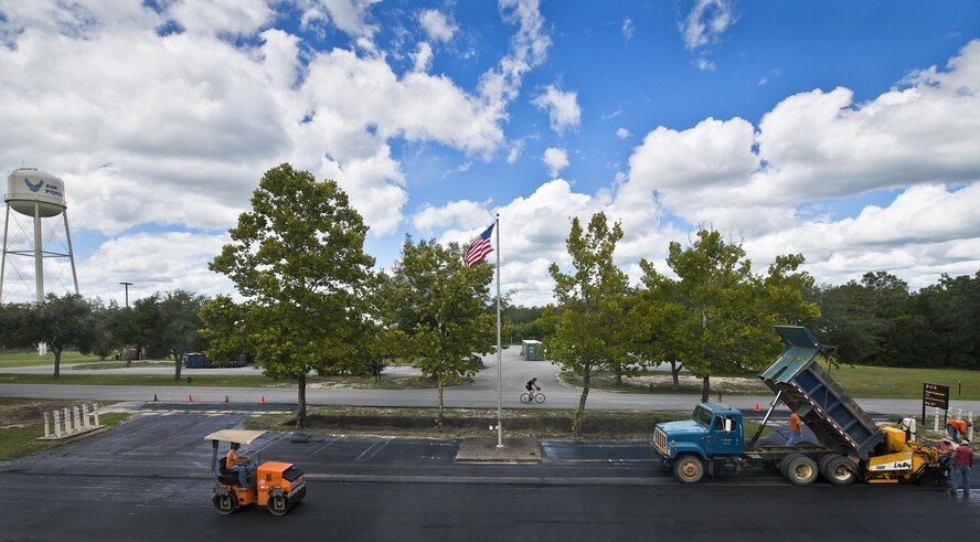 Asphalt paving is underway in front of the 919th Special Operations Wing’s Haugen Headquarters building Aug. 31 at Duke Field, Fla.  (U.S. Air Force photo/Tech. Sgt. Sam King)