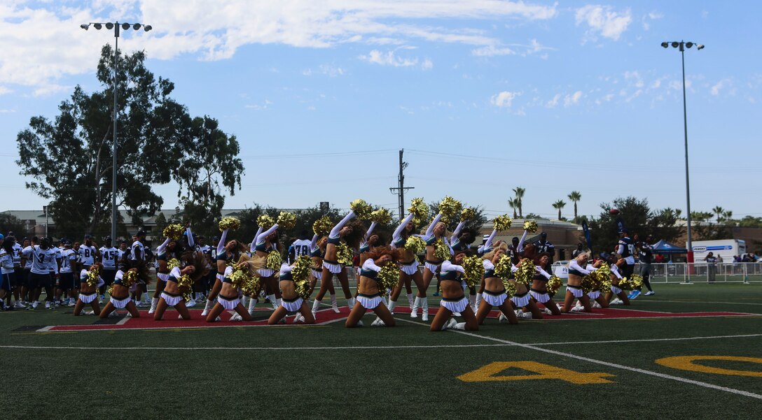 The San Diego Chargers cheerleaders perform a routine at the Miramar Sports Complex during the Chargers visit aboard Marine Corps Air Station Miramar, Calif., Aug. 31. While aboard station, the Chargers met service members and autographed various items for them. This event demonstrates the close ties between MCAS Miramar and the San Diego community. (U.S. Marine Corps photo by Lance Cpl. Harley Robinson/Released)