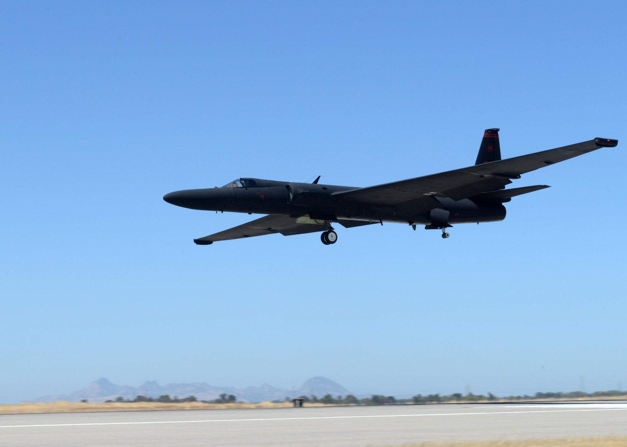 A U-2 Dragon Lady piloted by Maj. J.J., 1st Reconnaissance Squadron student pilot, prepares to land Aug. 31, 2016, at Beale Air Force Base, California. J.J.'s flight qualified him as the 1,000 pilot to operate the U-2 in the aircrafts 61 years of service. (U.S. Air Force photo by Senior Airman Ramon A. Adelan)