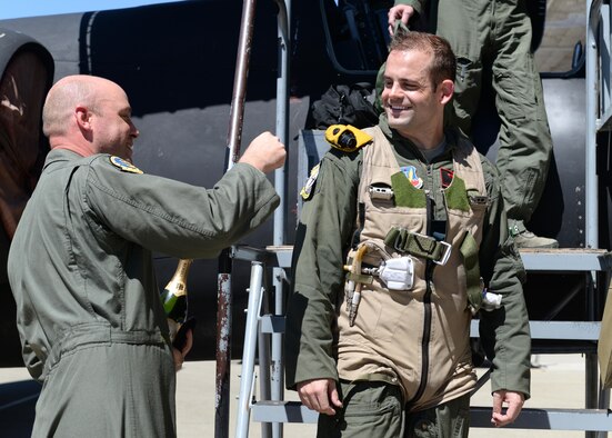 Lt. Col. Paul Wurster (left), 1st Reconnaissance Squadron commander, places Maj. J.J.’s, 1st RS student pilot, U-2 Dragon Lady patch after qualifying as the 1,000 pilot to operate the U-2 Aug. 31, 2016, at Beale Air Force Base, California. To have the opportunity to fly a U-2, the applicant must be a pilot in the U.S. Armed Forces, have obtained 1200 rated flight hours or other variables depending on aircraft flown, 12 months or 400 hours as pilot in command, and have gone through the application process. (U.S. Air Force photo by Senior Airman Ramon A. Adelan)