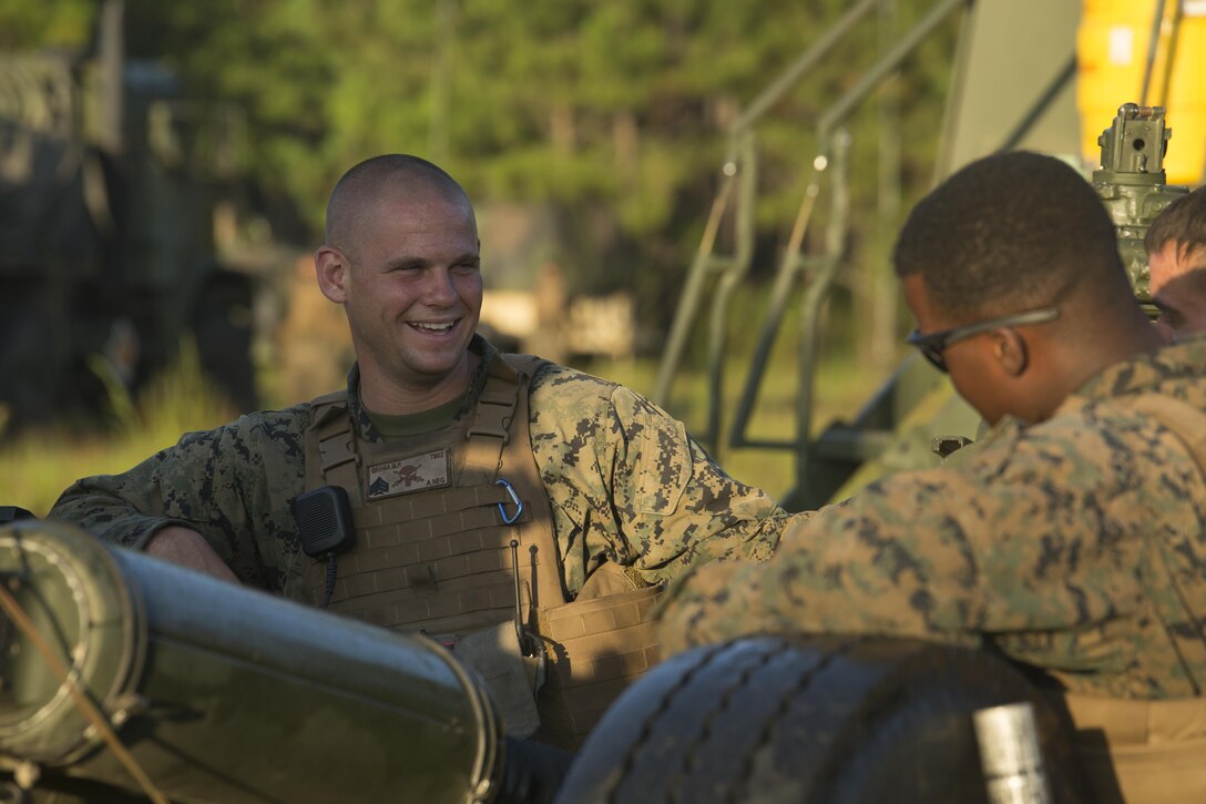 Gun chief, Sgt. Michael Grega with Alpha Battery, 1st Battalion, 10th Marine Regiment connects with his Marines before the indirect fire range during exercise Arrowhead Thunder at Fort Stewart, G.A., Aug. 15, 2016. The Marines conducted the range to complete their annual training. (U.S. Marine Corps photo by Lance Cpl. Victoria Ross)