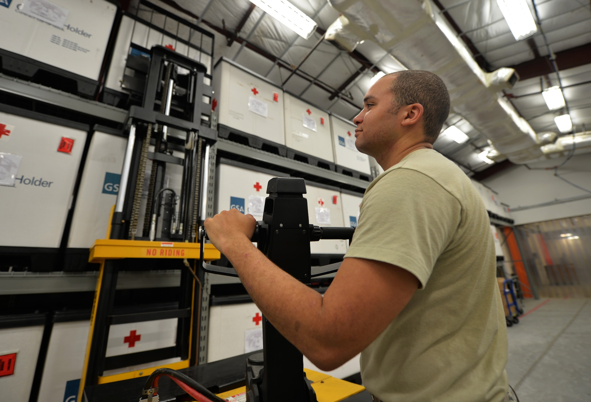 Senior Airman Christopher Lomax, a medical logistics journeyman from the 1st Special Operations Medical Support Squadron, uses a forklift to reach supplies on a tri-wall at Hurlburt Field Fla., Aug. 30, 2016. A tri-wall holds supplies that are sent to deployed troops if biological, nuclear or radiological emergencies occur. (U.S. Air Force photo by Senior Airman Andrea Posey)