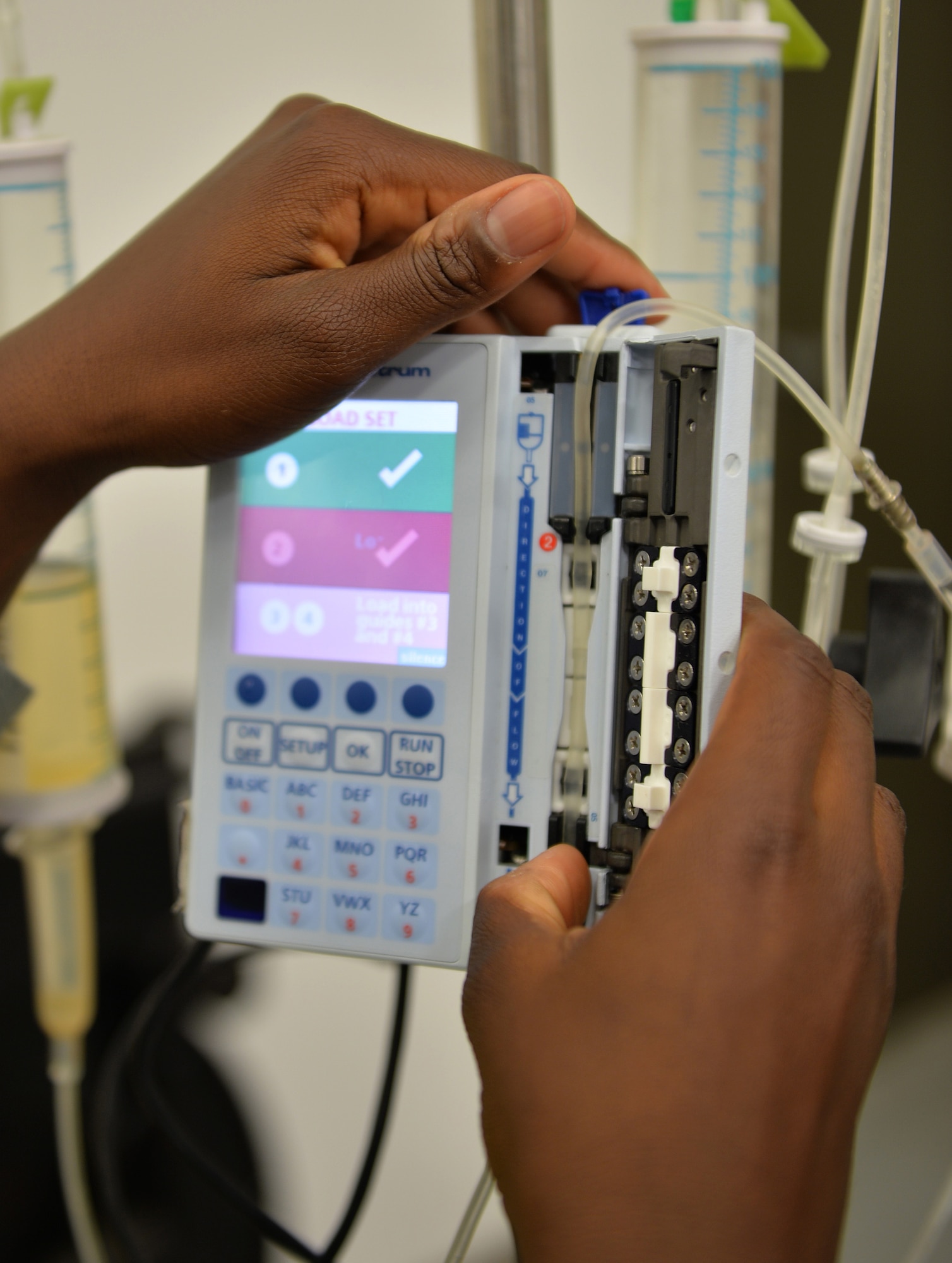 Airman 1st Class Temitope Odedele, a biomedical equipment technician assigned to the 1st Special Operations Medical Support Squadron, checks the memory function on an infusion pump at Hurlburt Field, Fla., Aug. 30, 2016. An infusion pump is used to infuse fluids, medication or nutrients into a patient's circulatory system. (U.S. Air Force photo by Senior Airman Andrea Posey)