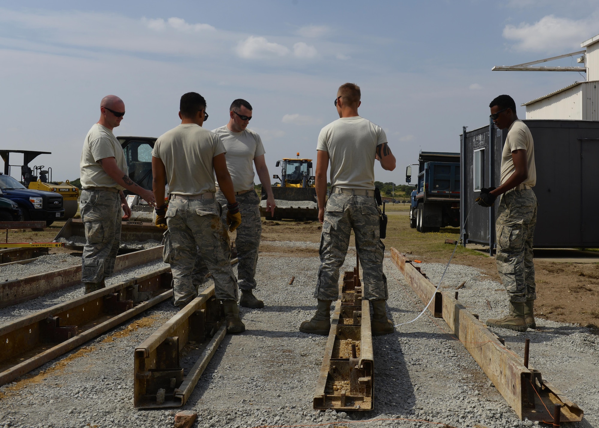 The Dirt Boyz, 48th Civil Engineer Squadron pavements and construction equipment Airmen, work on a foundation at RAF Lakenheath, England, Aug. 18. The foundation is for a modular building addition for the 56th Rescue Squadron. (U.S. Air Force photo/ Airman 1st Class Abby L. Finkel) 