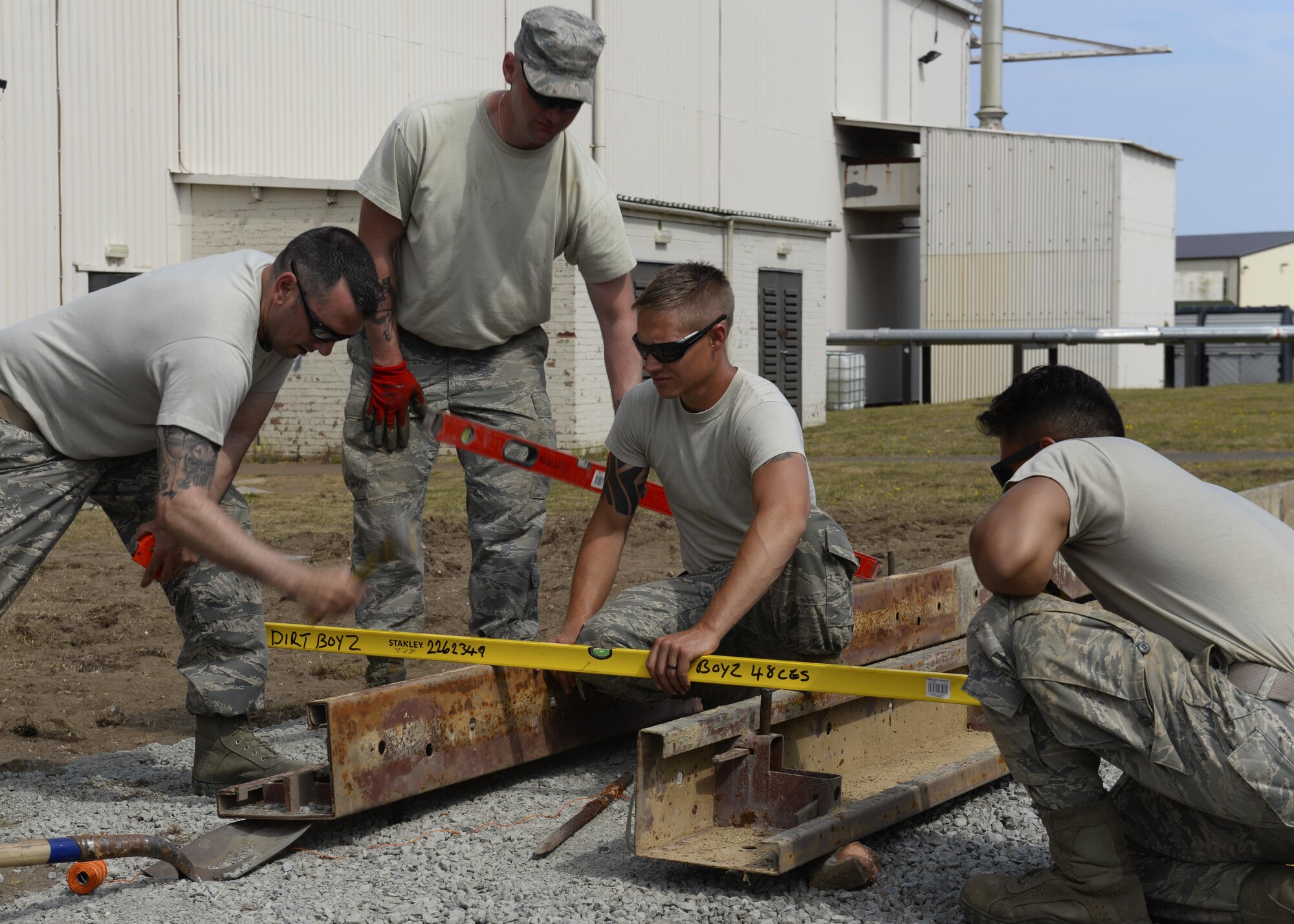 The Dirt Boyz, 48th Civil Engineer Squadron pavements and construction equipment Airmen, work on a foundation at RAF Lakenheath, England, Aug. 18. The foundation is for a modular building addition for the 56th Rescue Squadron. (U.S. Air Force photo/ Airman 1st Class Abby L. Finkel) 