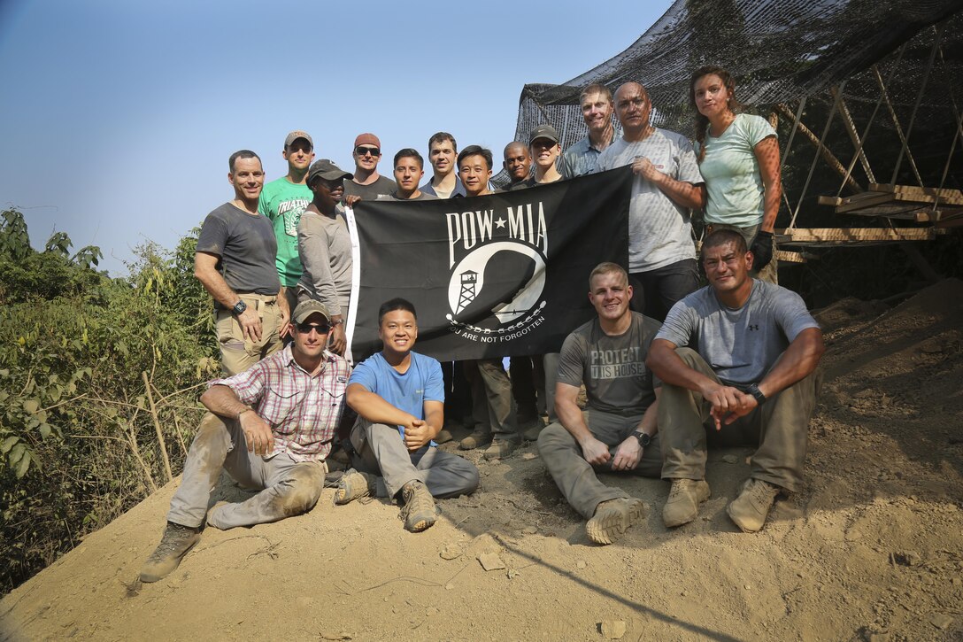 District archaeologist Jeremy Decker (top row, 3rd from right) and the DPAA team.