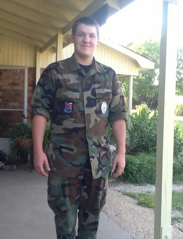 Lance Cpl. Jacob Beasley stands outside his home wearing an Air Force Junior Reserve Officer Training Corps uniform at the age 17 weighing 260 pounds. Beasley dedicated the summer of 2014 to lose the weight to enlist in the United States Marine Corps. (Photo courtesy of Lance Cpl. Jacob Beasley/Released)