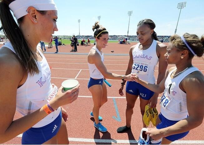 Second Lieutenant Rhavean Anderson (pictured second from the right), alongside her teammates, competed in the women’s distance medley at Rock Chalk Park in Lawrence, Kansas, on April 2014. The team went on to win and break a record with a time of 11 minutes 31 seconds and 21 nanoseconds. (Photo courtesy of 2nd Lt. Rhavean Anderson/Released)