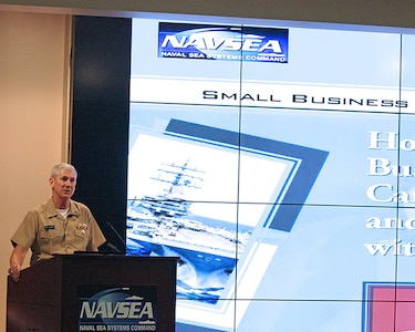 Vice Admiral Thomas Moore, Commander, NAVSEA provides a brief welcome and introduction at the start of the Small Business Industry Day in the Humphreys Auditorium, Naval Sea Systems Command headquarters.