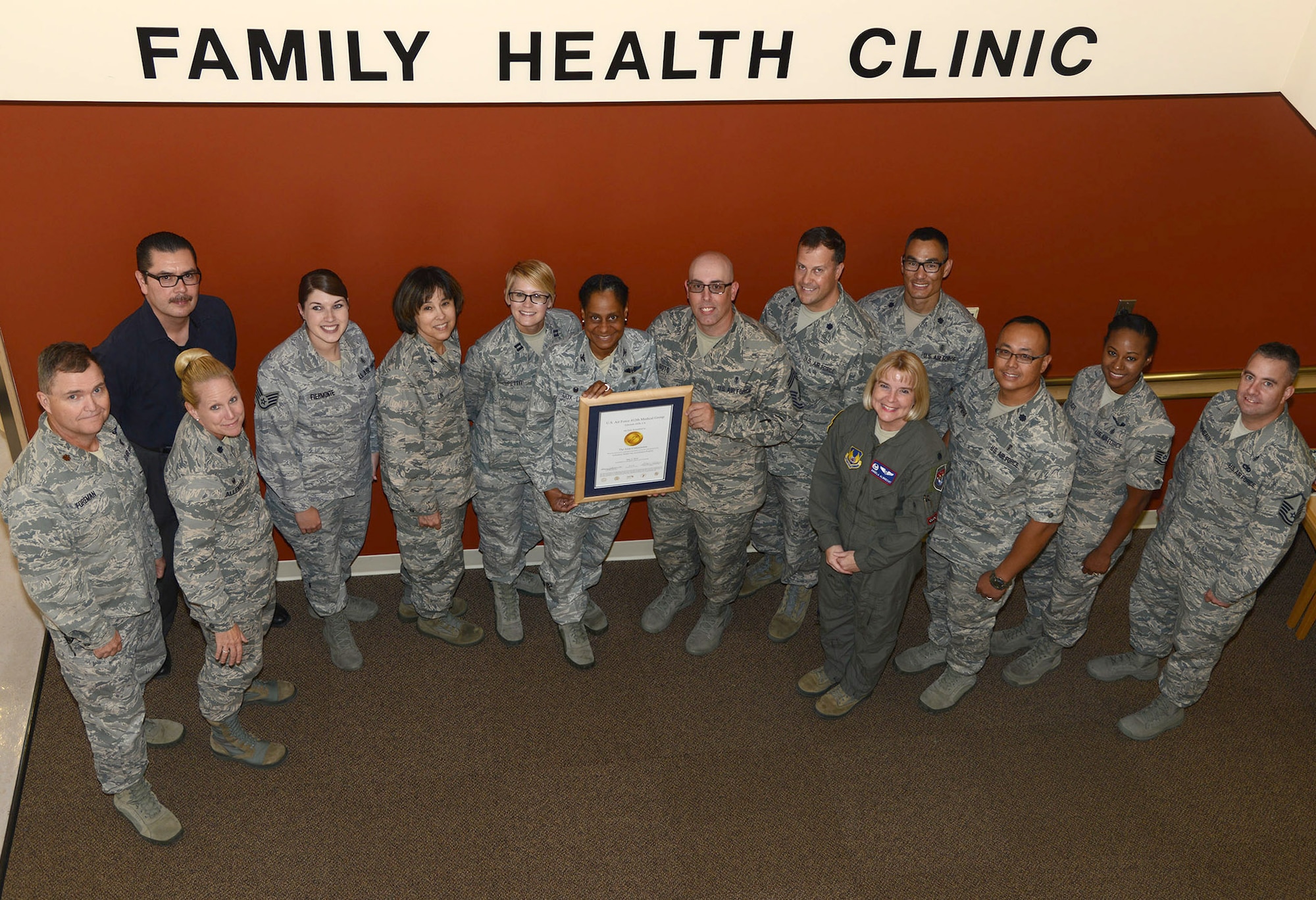 Members of the 412th Medical Group pose for a group shot with their accreditation certificate. 

The Edwards Clinic was recently reaccredited for 36 months by the Joint Commission.
 
The Joint Commission, a non-governmental, not-for-profit organization, established the Ambulatory Health Care Accreditation Program in 1975 to encourage safe, high quality patient care in all types of freestanding ambulatory care facilities. Today, the Ambulatory Health Care program accredits over 2,100 organizations in a variety of settings. For more information, visit www.jointcommision.org

Ambulatory health care services are those provided on an outpatient basis.
