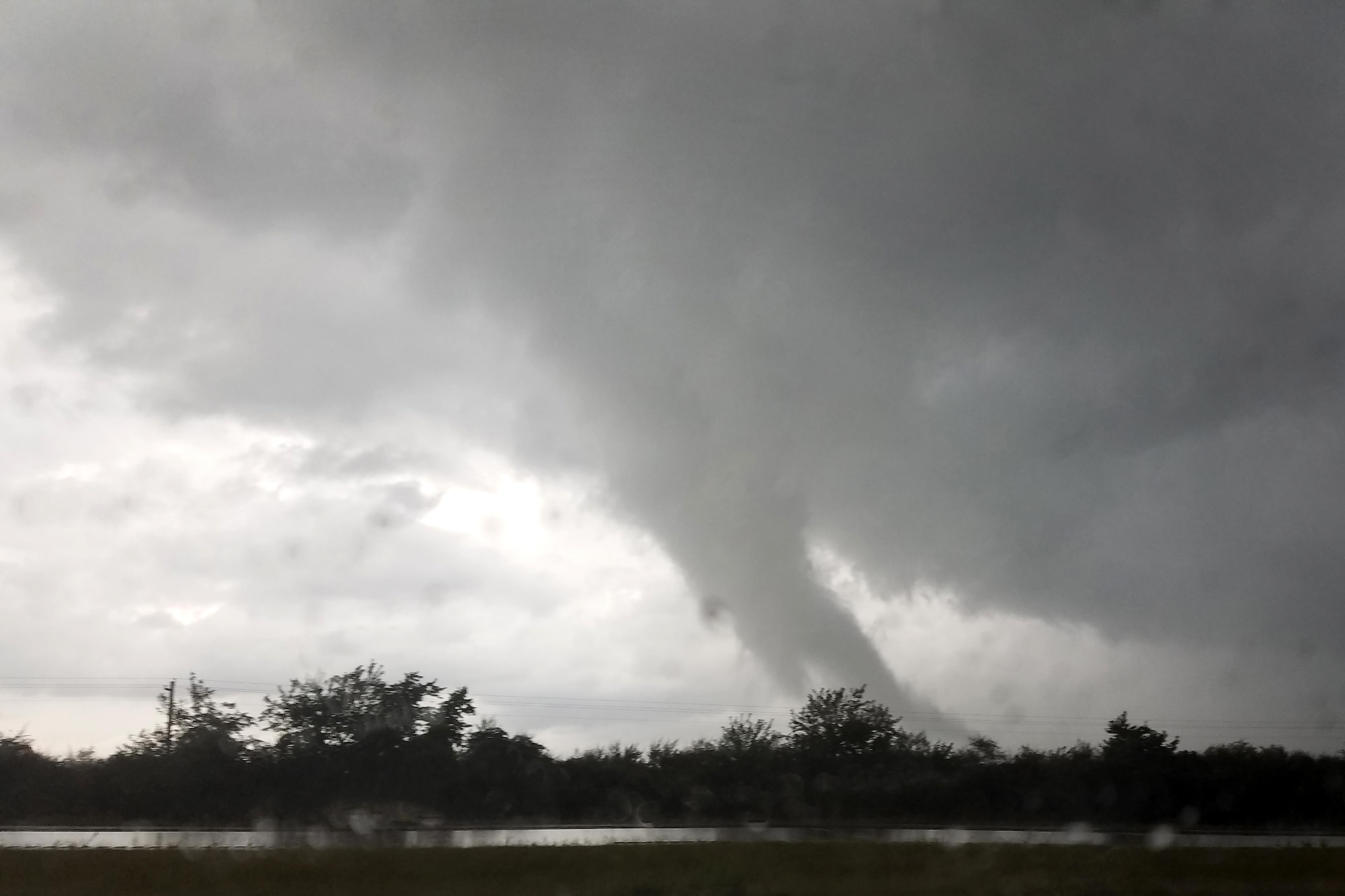 A funnel cloud is photographed over a cornfield in Miami County, Indiana Aug. 24, 2016. The same storm cell also produced an EF3 tornado and several others in Kokomo, Indiana that resulted in hundreds of damaged homes and 25,000 homes and businesses in the Kokomo area without electricity. (U.S. Air Force photo/Tech. Sgt. Benjamin Mota)