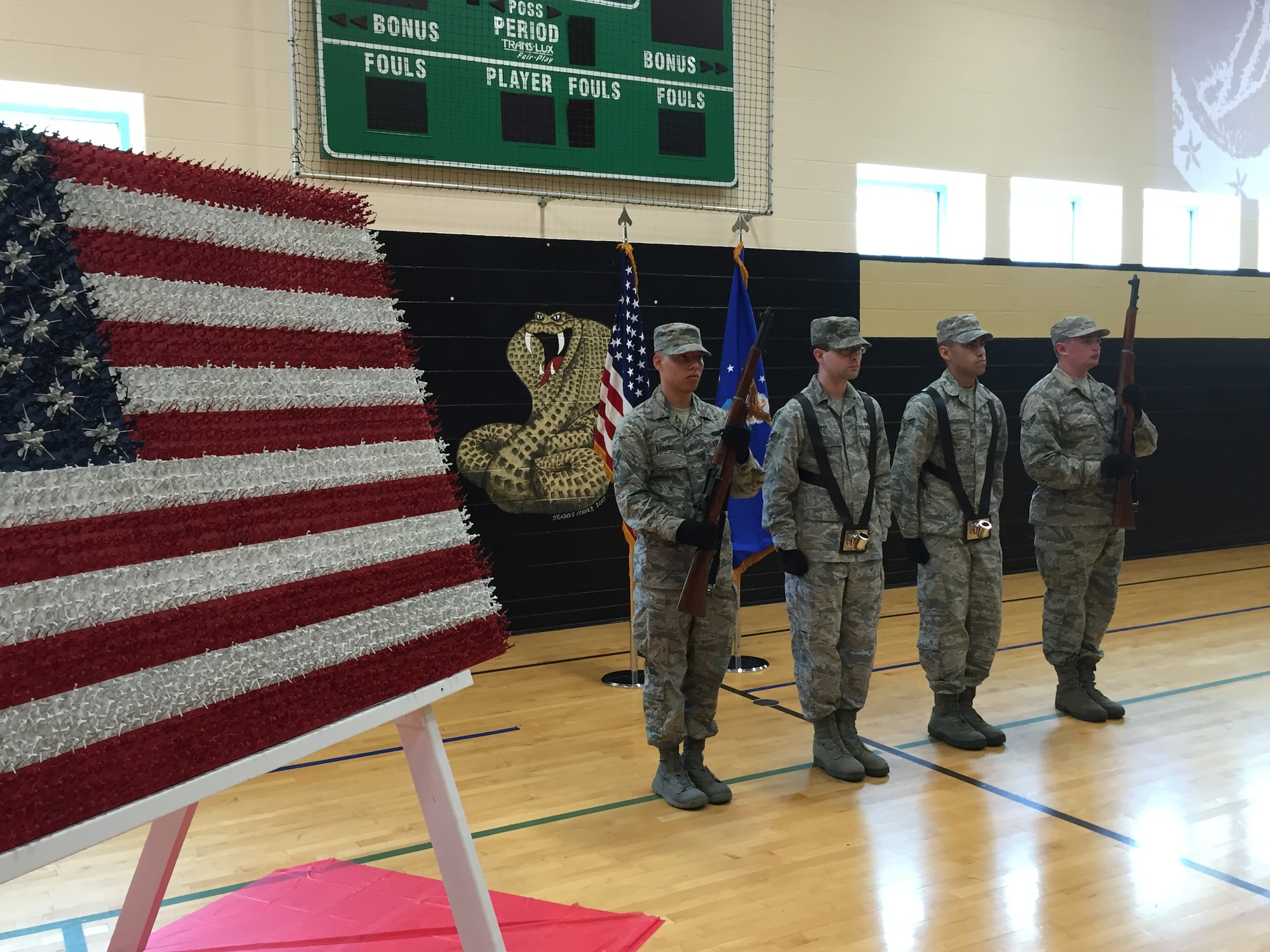 Members of the honor guard from the National Air and Space Intelligence Center present the colors during a ceremony at Montgomery County Juvenile Court’s Center for Adolescent Services Aug. 24 in New Lebanon. The ceremony was held in recognition of efforts by members of the Justice Mentoring Program, a mentoring and community outreach nonprofit program in the greater Dayton area. Many of the members are Airmen at Wright-Patterson Air Force Base. (Skywrighter photos/Amy Rollins) 