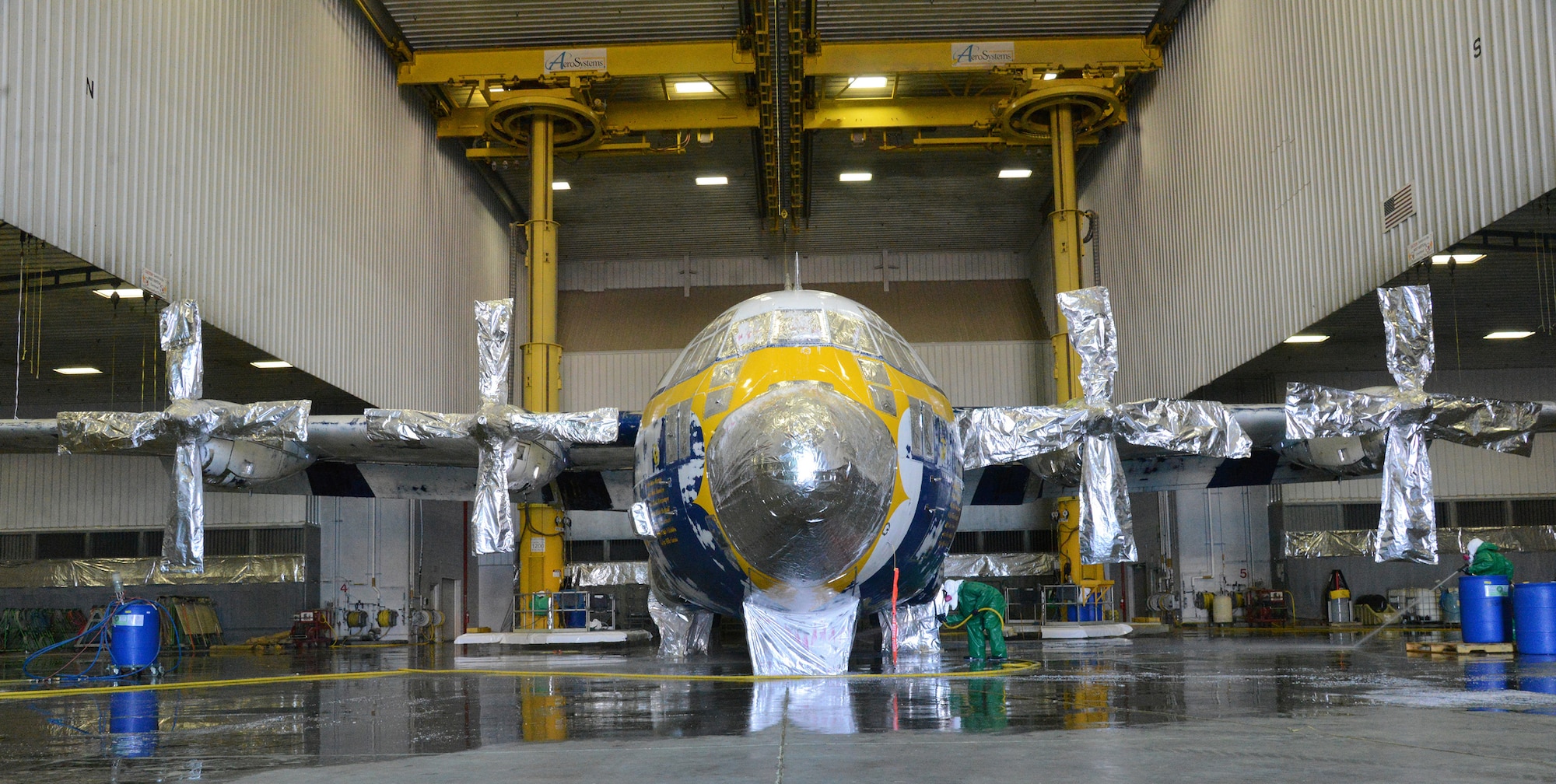 Fat Albert, the Blue Angels’ C-130 cargo plane used for transporting crew and equipment to air shows around the country, recently underwent a chemical de-paint process here after severe corrosion was found on it. Crews stripped the aircraft of all paint, using a stripping agent to remove one layer at a time. Next, Fat Albert will fly to Hill Air Force Base, Utah, for full programmed depot maintenance and paint. (Air Force photo by Kelly White)