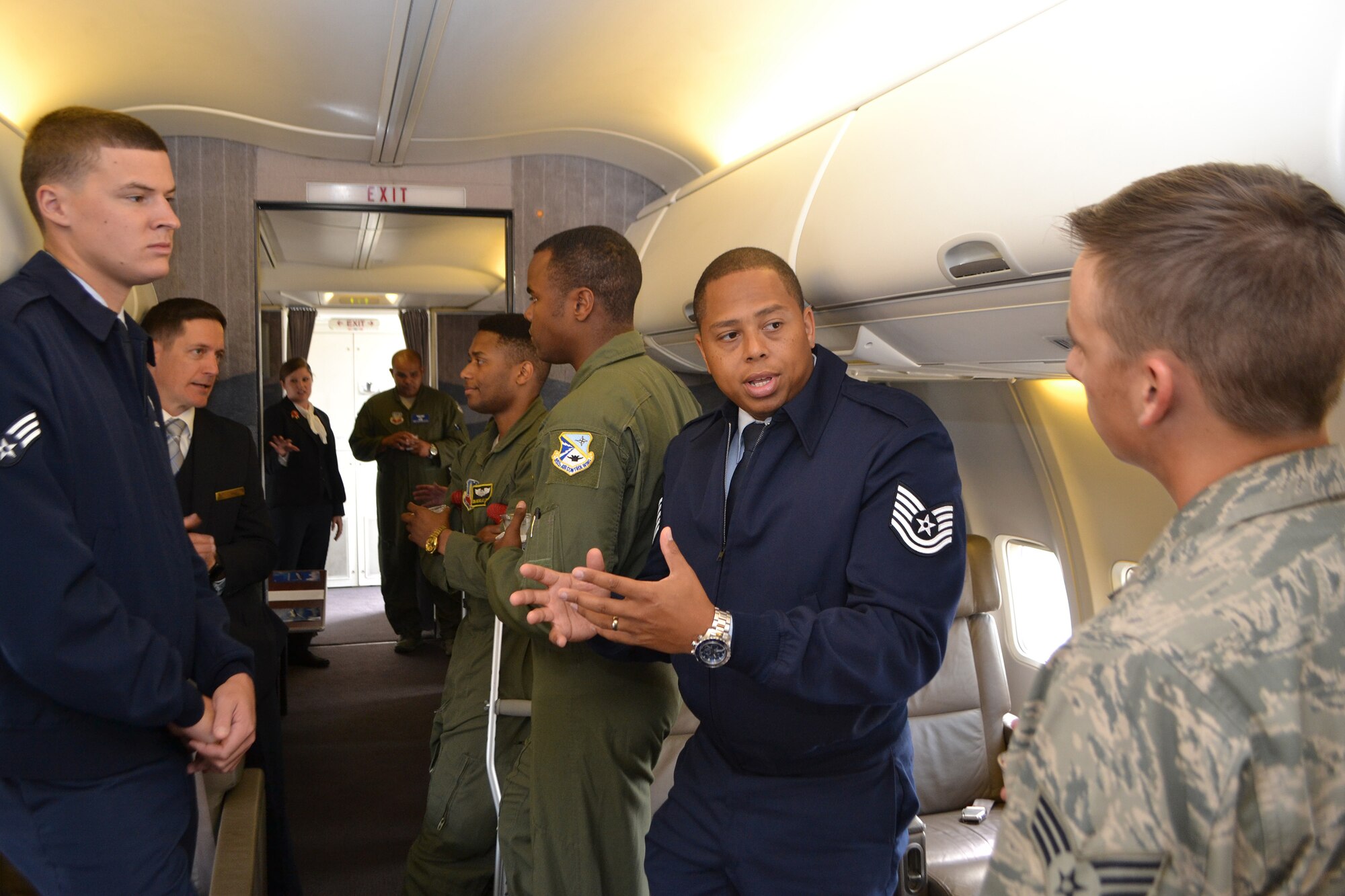 Tech. Sgt. Willie Hoover, center, an information controller with the 89th Aerial Port Squadron at Andrews Air Force Base, Md., describes his duties to Senior Airman Mason, right, 552nd Maintenance Squadron, during a tour of a C-40A aircraft used by the 89th Airlift Wing to transport senior government and military officials. Sergeant Hoover was part of a recruiting team that visited Tinker Aug. 29. The 89th is looking for pilots, flight engineers, communications systems operators (1A3), flying crew chiefs and flight attendants. Approximately 50 members from the 552nd Air Control Wing and 72nd Air Base Wing attended a briefing in Fannin Hall and then toured the aircraft. (Air Force photo by Ron Mullan)