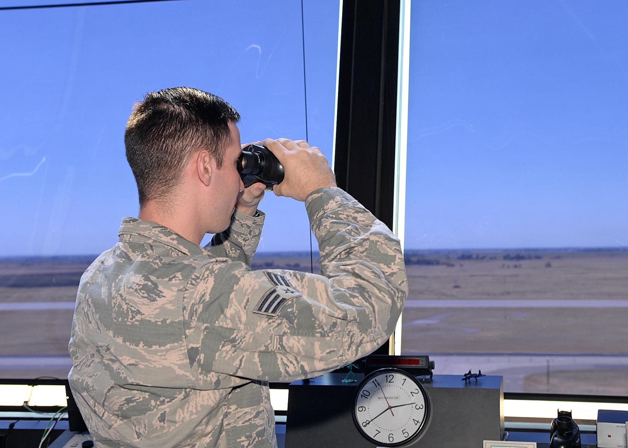 Senior Airman Joseph Shine, 9th Operations Support Squadron air traffic controller, watches an aircraft land Aug. 31, 2016, at Beale Air Force Base, California. The Beale air traffic control tower won the Air Force’s 2015 air traffic control tower of the year. (U.S Air Force photo by Airman Tristan D. Viglianco)