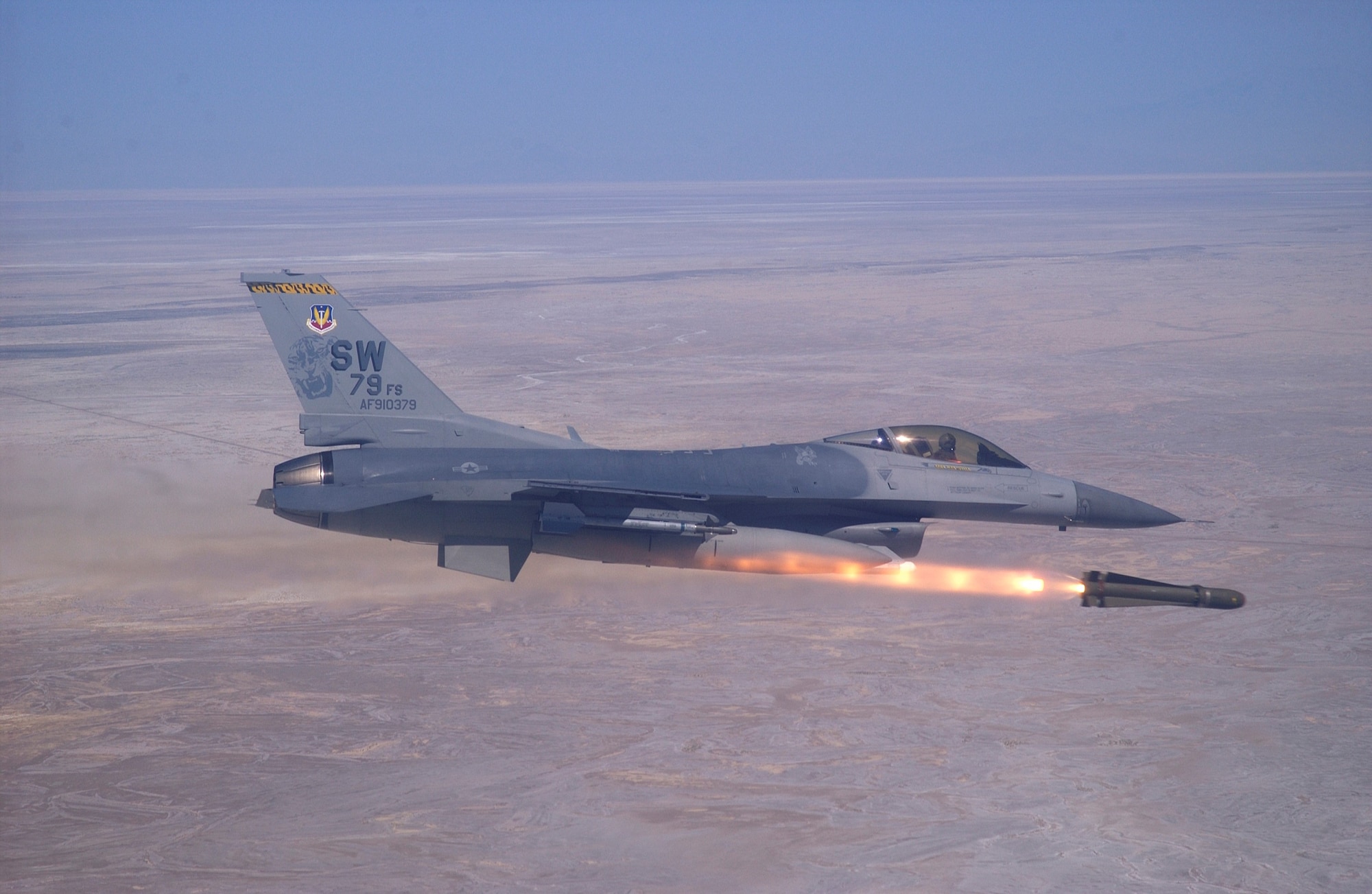 An F-16CM Fighting Falcon assigned to the 55th Fighter Squadron fires a missile during operation Southern Watch in 2002. F-16s provided support in the annihilation of enemy surface to air units throughout many operations including Northern Watch and currently Operation Inherent Resolve. (Courtesy photo)