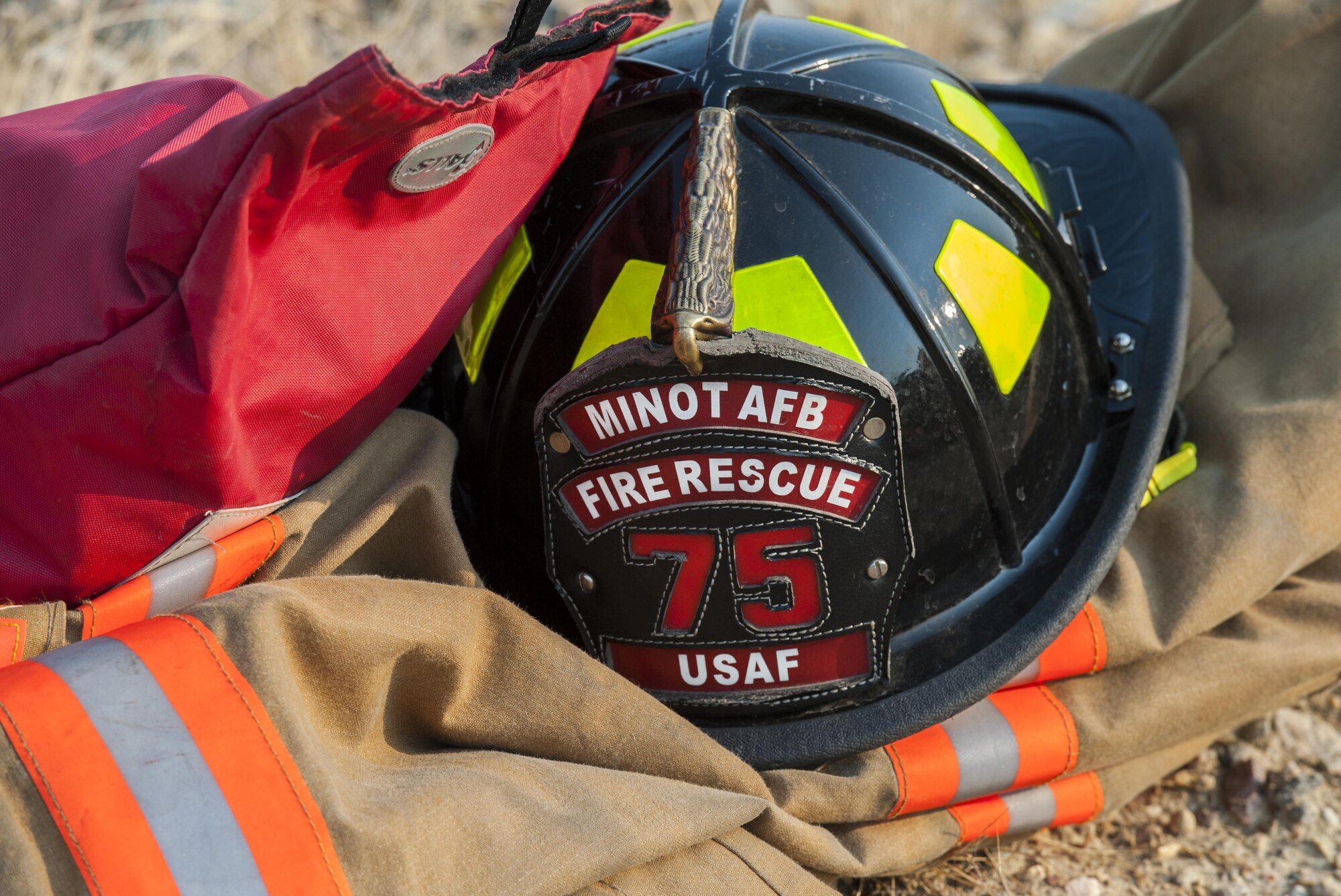 A fireman’s helmet sits on his jacket before training at Minot Air Force Base, N.D., Sept. 1, 2016.  The base’s fire department specializes in handling everything from brush fires to burning rocket fuel and hazardous material fires. (U.S. Air Force photo/Airman 1st Class Christian Sullivan)