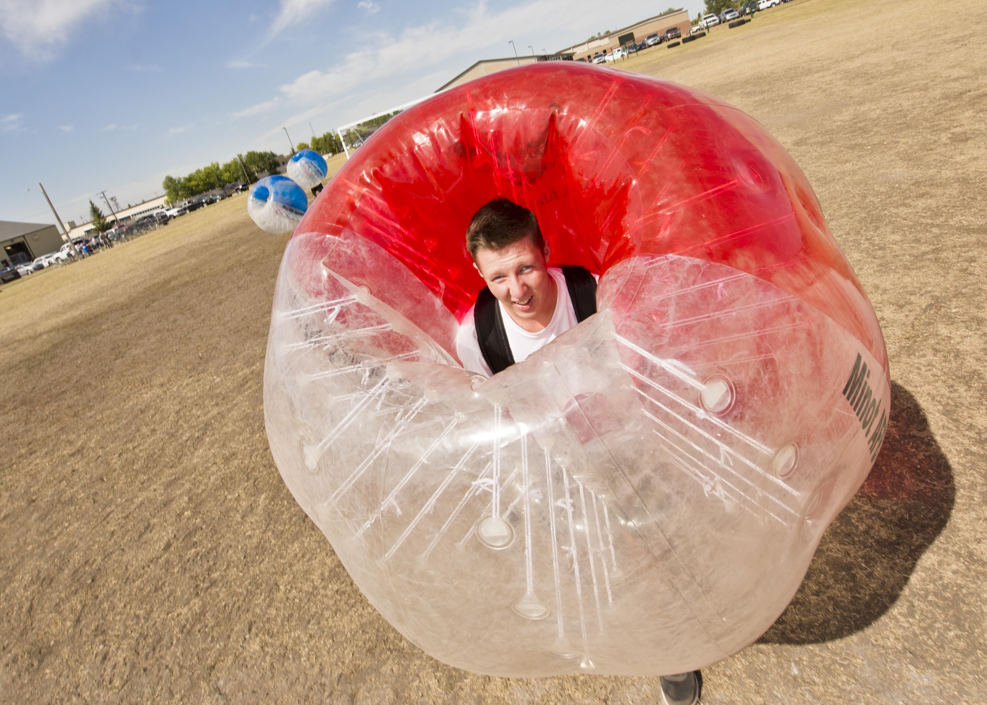 Airman 1st Class Christian Sullivan, 5th Bomb Wing Public Affairs photojournalist, pauses for a photo while playing knockerball during the Summer Games at Minot Air Force Base, N.D., Aug. 30, 2016. The Summer Games hosted new events included knockerball, build a boat and 4x200m freestyle relay. (U.S. Air Force photo/Airman 1st Class J.T. Armstrong)

