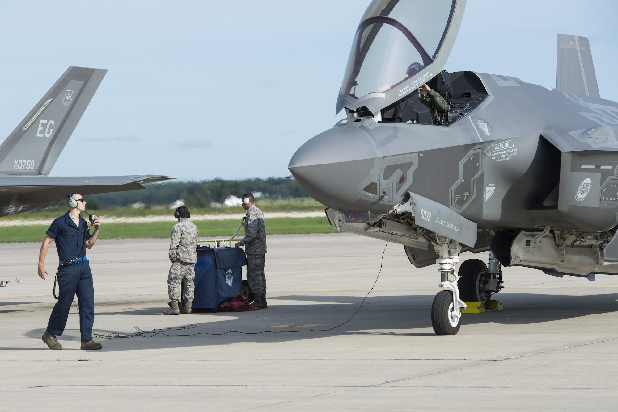 Airman 1st Class Derek Leuzinger, 33rd Aircraft Maintenance Squadron assistant dedicated crew chief, prepares to launch an F-35A during exercise Northern Lightning Aug. 26, 2016, at Volk Field, Wis. Northern Lightning is a joint total force exercise between the Air National Guard, Air Force and Navy conducting offensive counter air, suppression and destruction of enemy air defense and close air support. (U.S. Air Force photo by Senior Airman Stormy Archer)