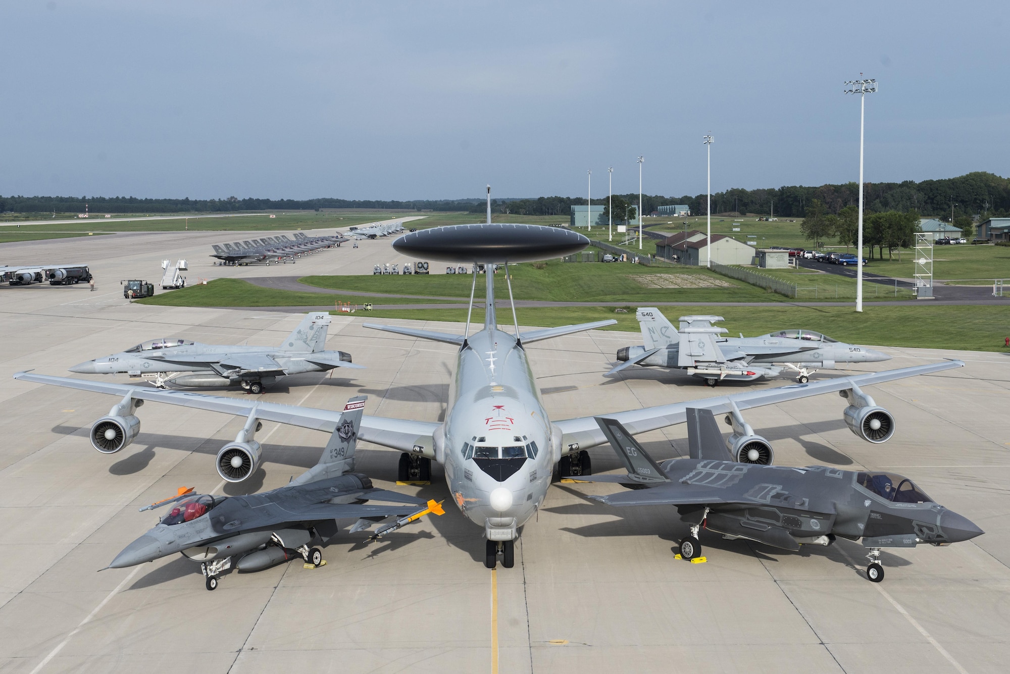 An F-16 Fighting Falcon, E-3 Sentry, F-35A Lightning II, F/A-18 Super Hornet and an EA-18 Growler are set up in a static display Aug. 29, 2016, during Exercise Northern Lightning at Volk Field, Wis. Northern Lightning allowed all five of these aircraft the opportunity integrate and operate in a joint environment while performing counter air, suppression and destruction of enemy air defense and close air support in a contested environment. (U.S. Air Force photo by Senior Airman Stormy Archer)
